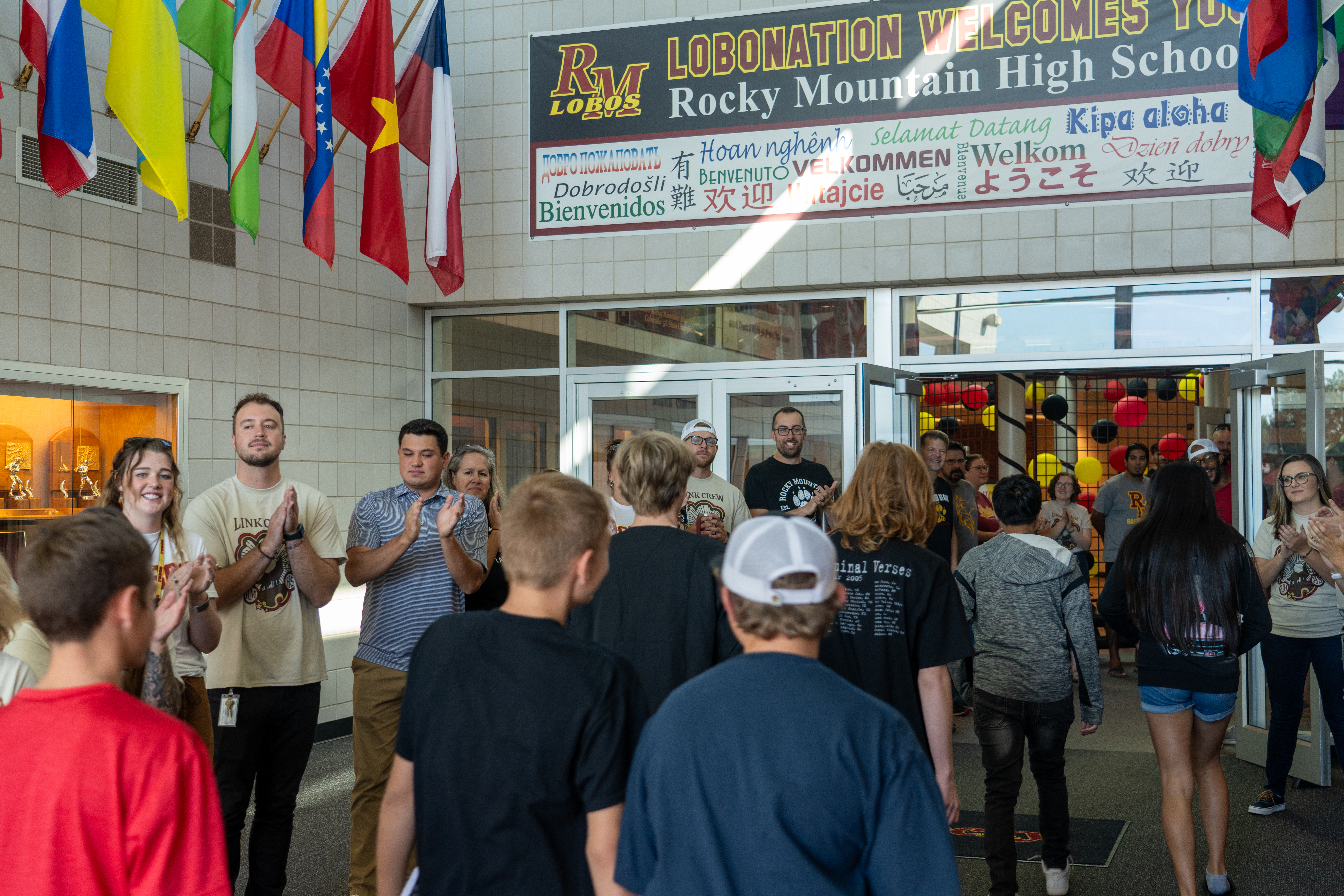 Students arrive at Rocky Mountain High School greeted by staff.