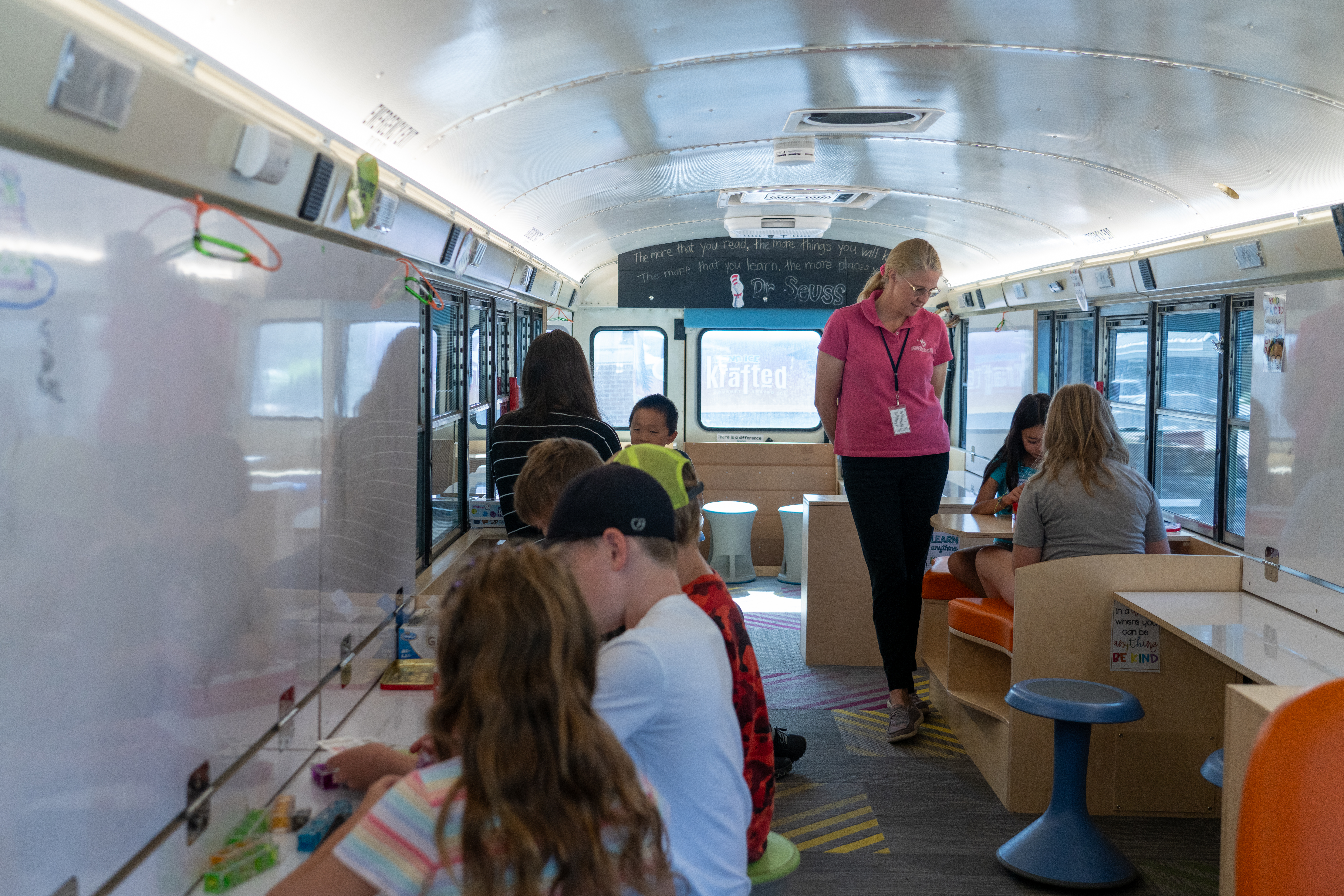 Students do learning activities inside Mac the Bus.