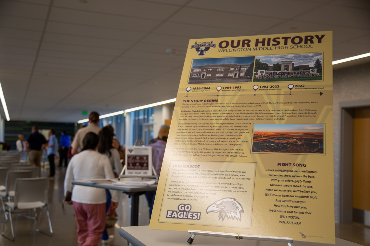 A poster about the history of the school is displayed in the common space. 