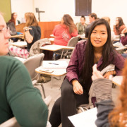 Colorado State University students talk with each other.