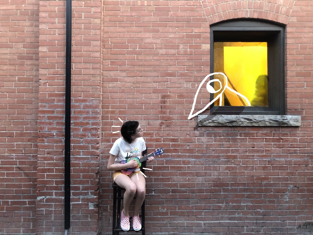Girl holding a ukulele by an open window