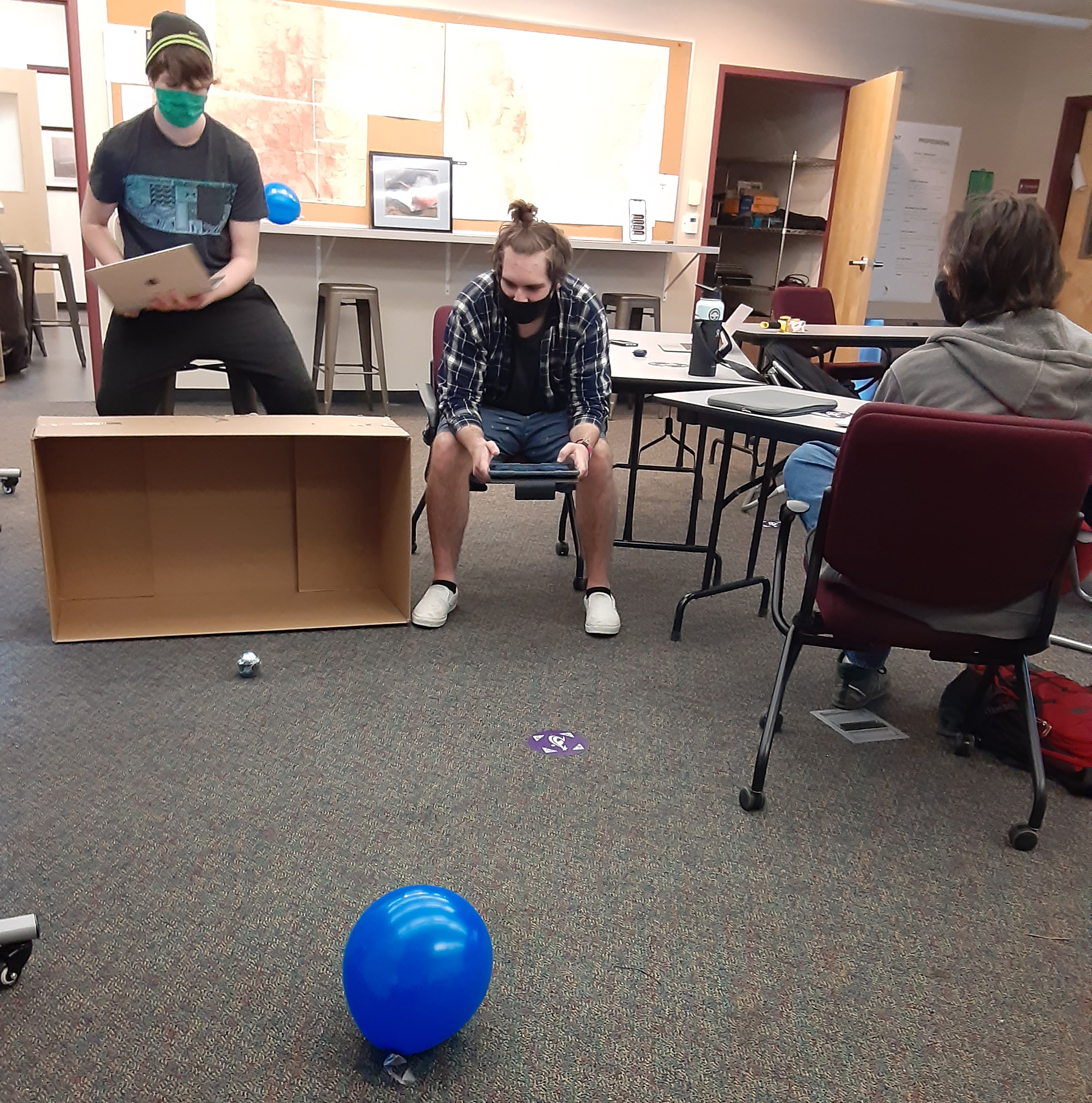 Two students work together on Spheros.