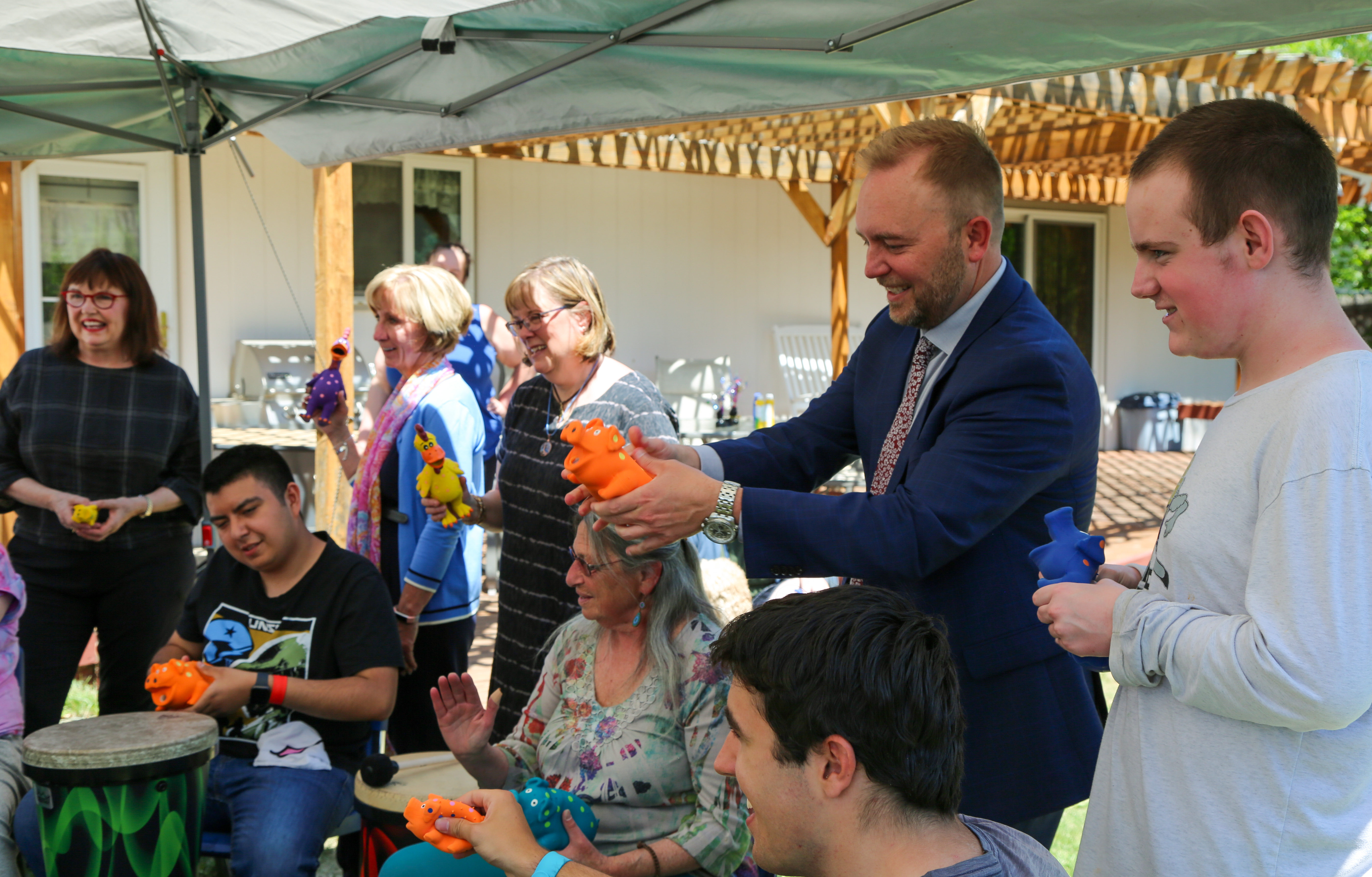 Squeaky toys make for fun at the Cooper Home program graduation.