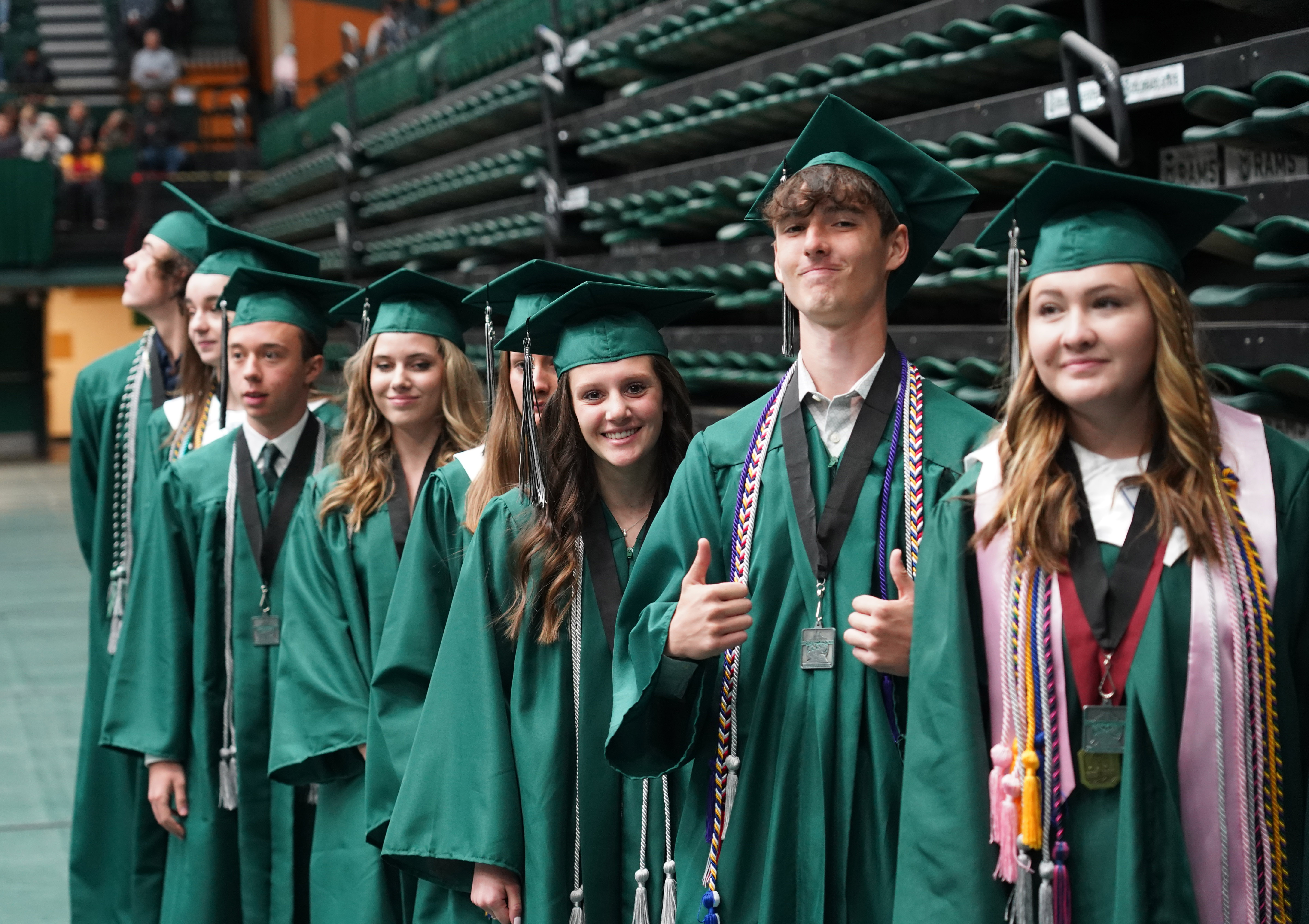 Fossil Ridge High School graduates smiling at the camera. 