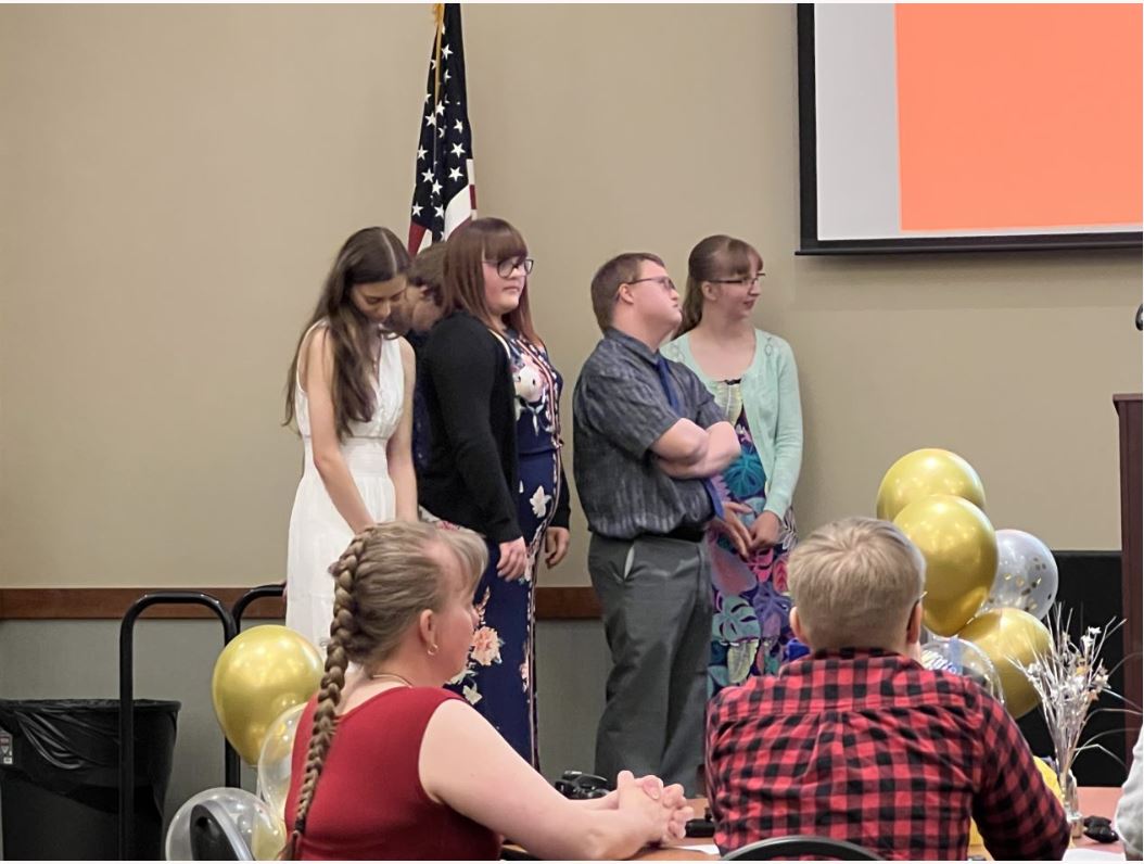 Project SEARCH graduates stand together in a group. 