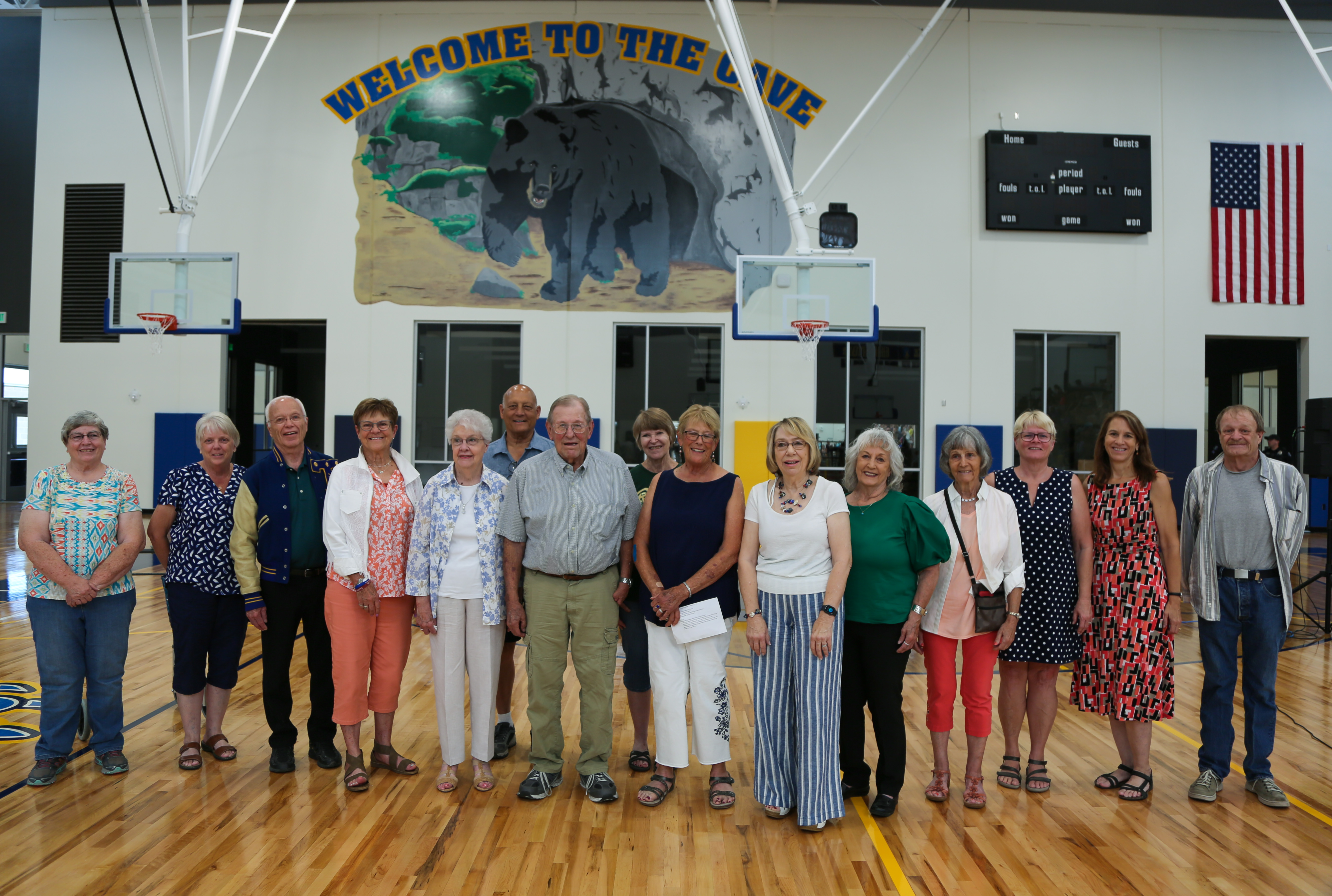 TMHS alumni from the original Timnath high school gather in the new gym. 