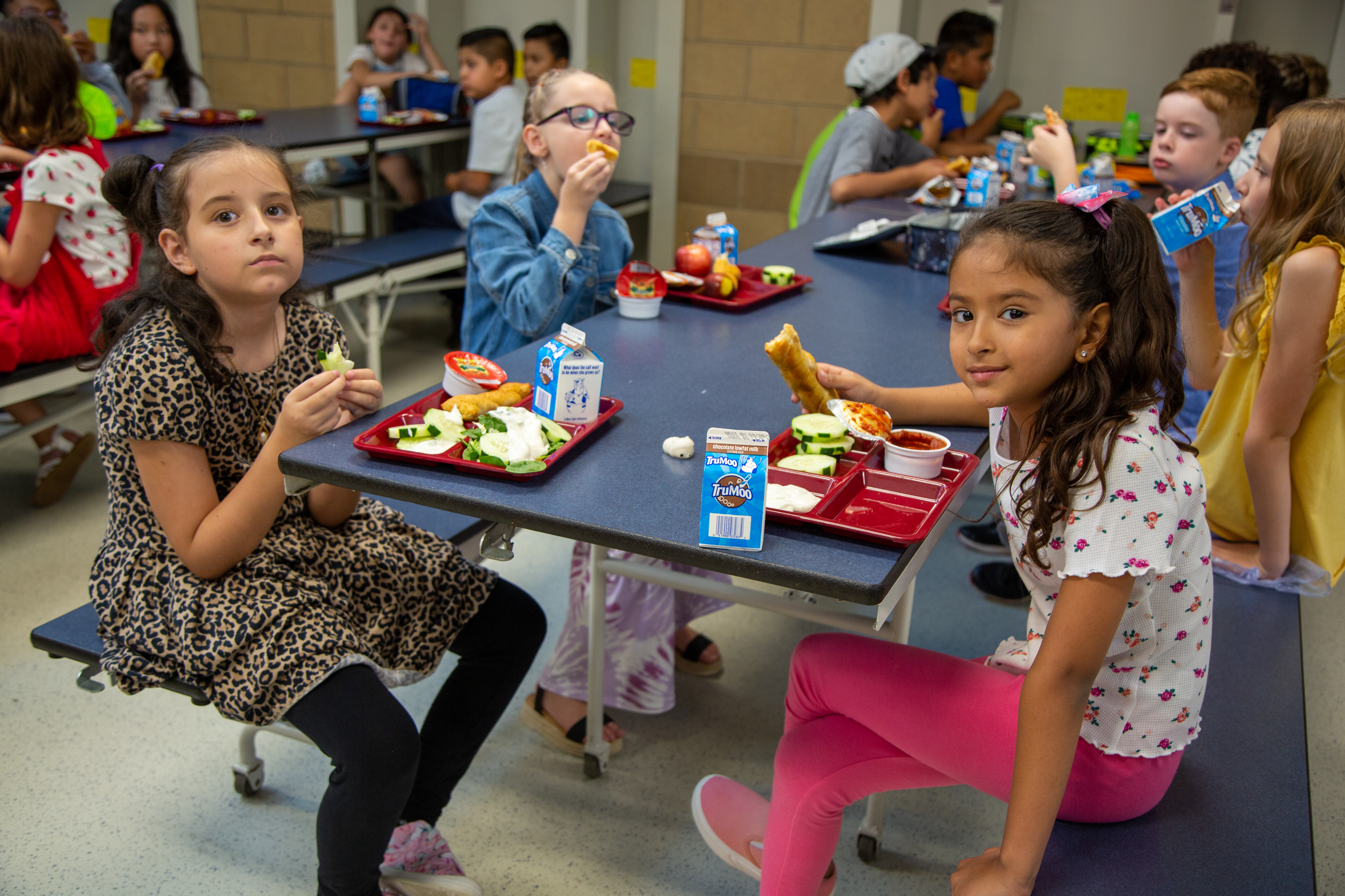 Linton Elementary girls eat lunch in the school cafeteria.
