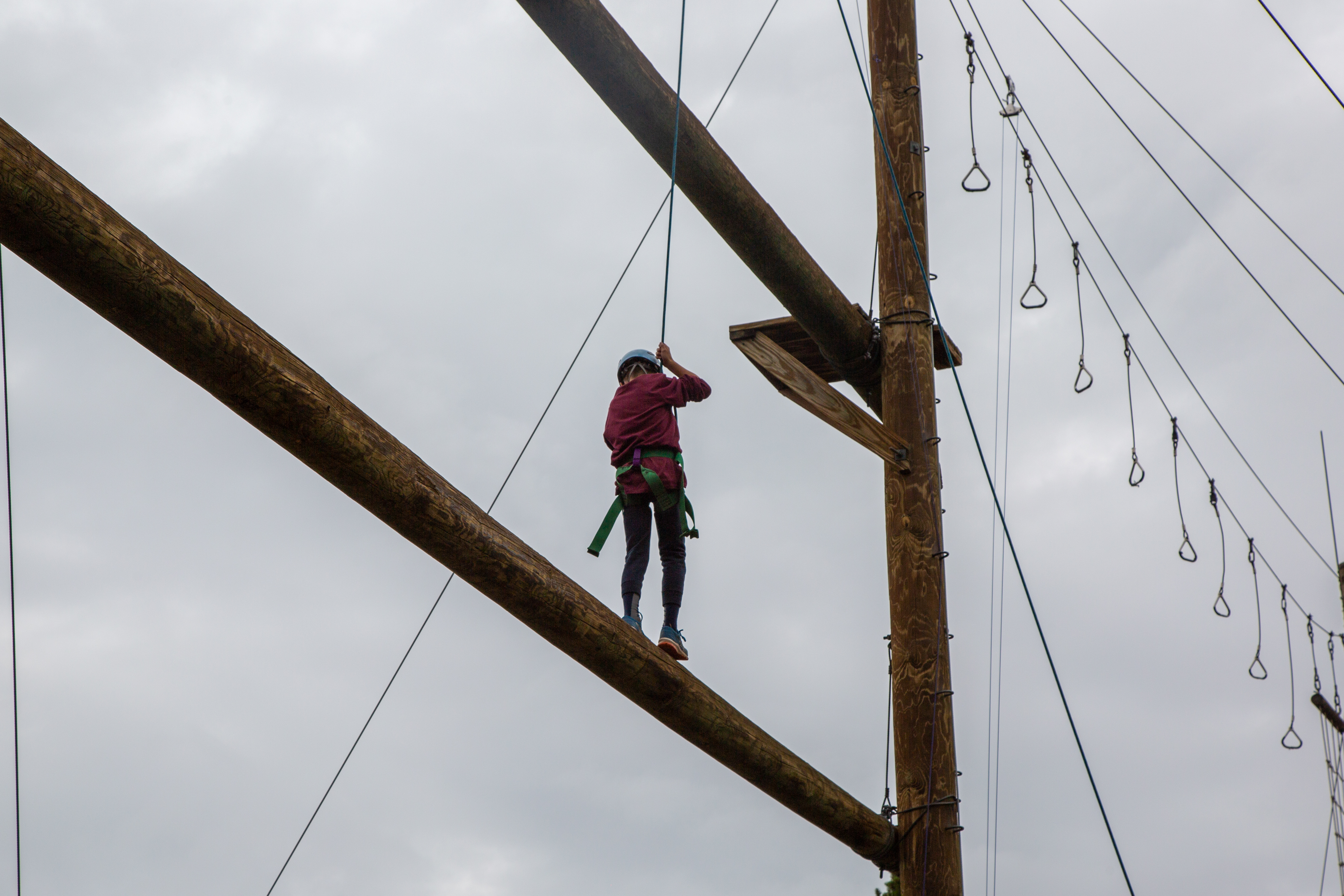 A student on the ropes course. 