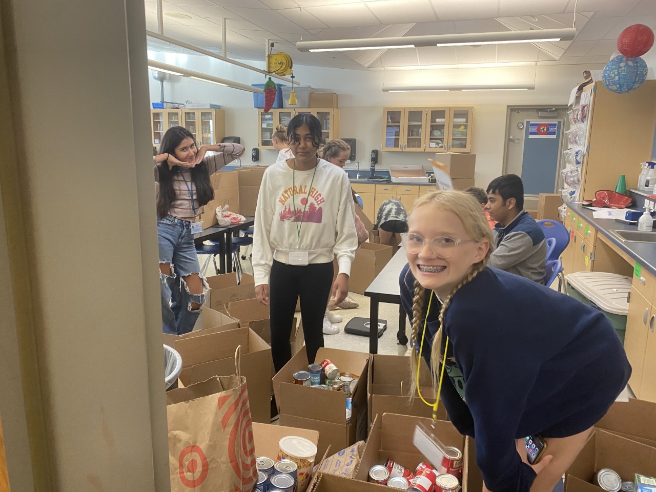Kinard Middle School students organize donated food. 