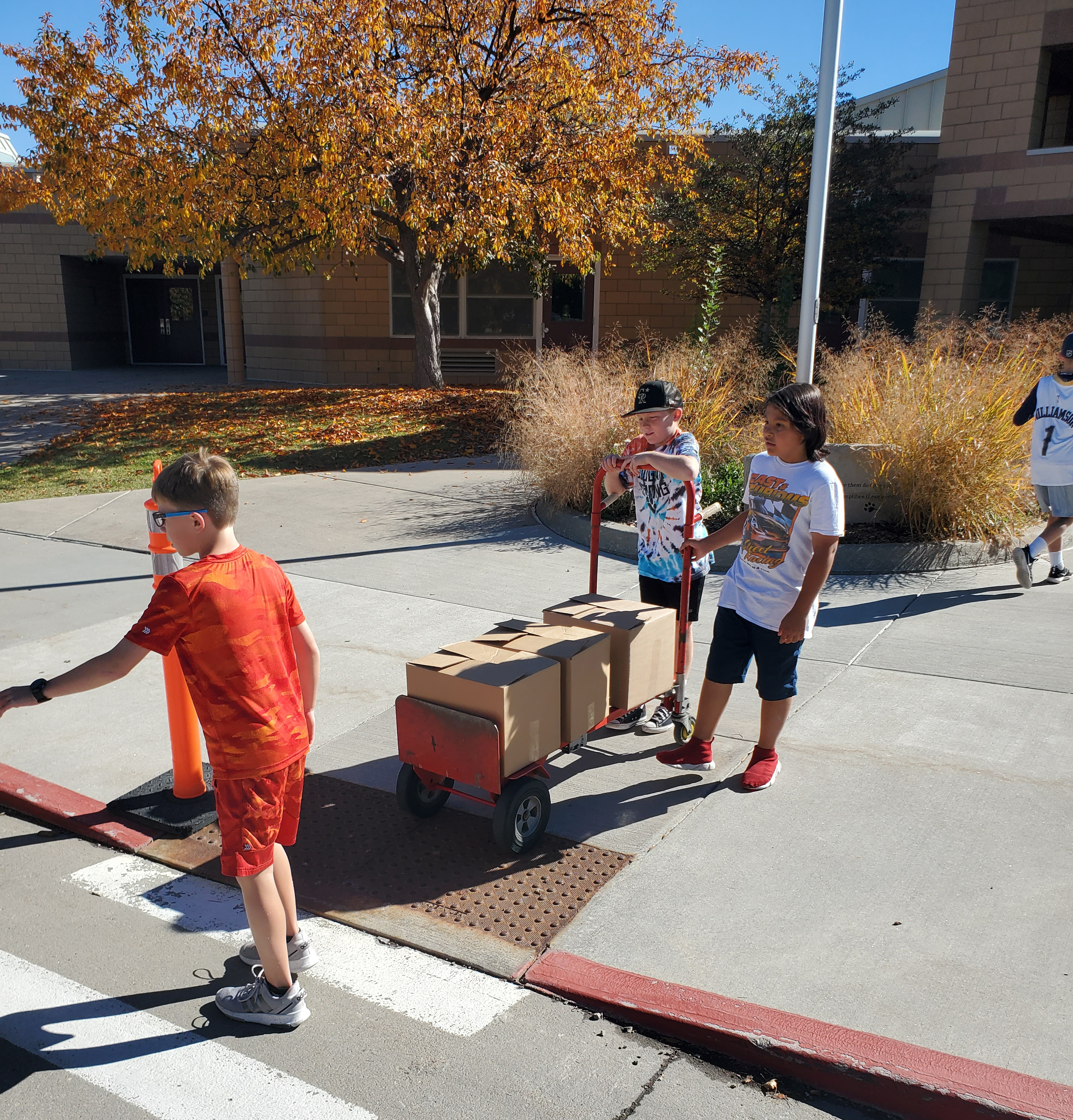 Kruse Elementary School students load up donated goods in vehicles. 