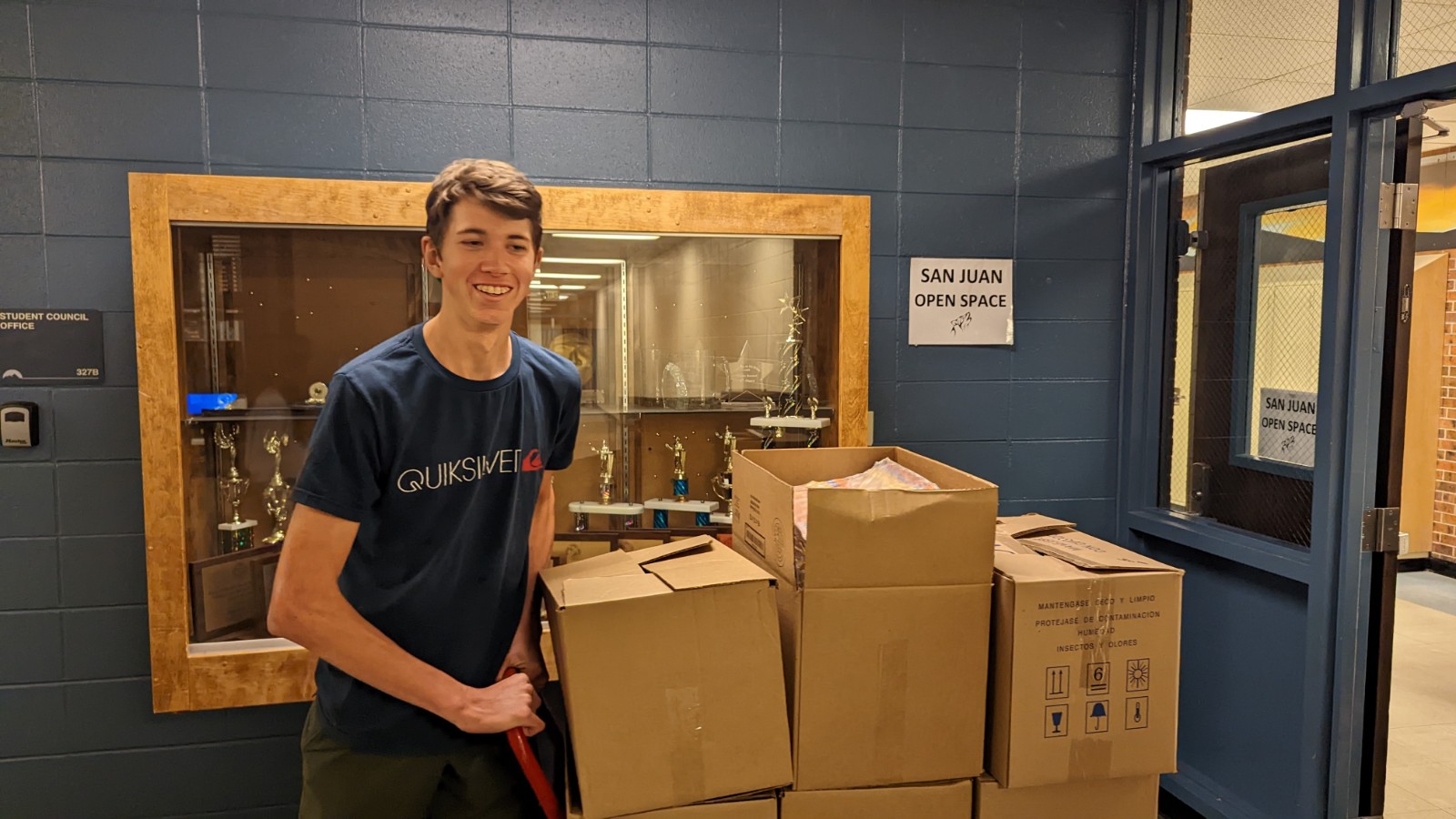 A Rocky Mountain High School student works on the food drive. 