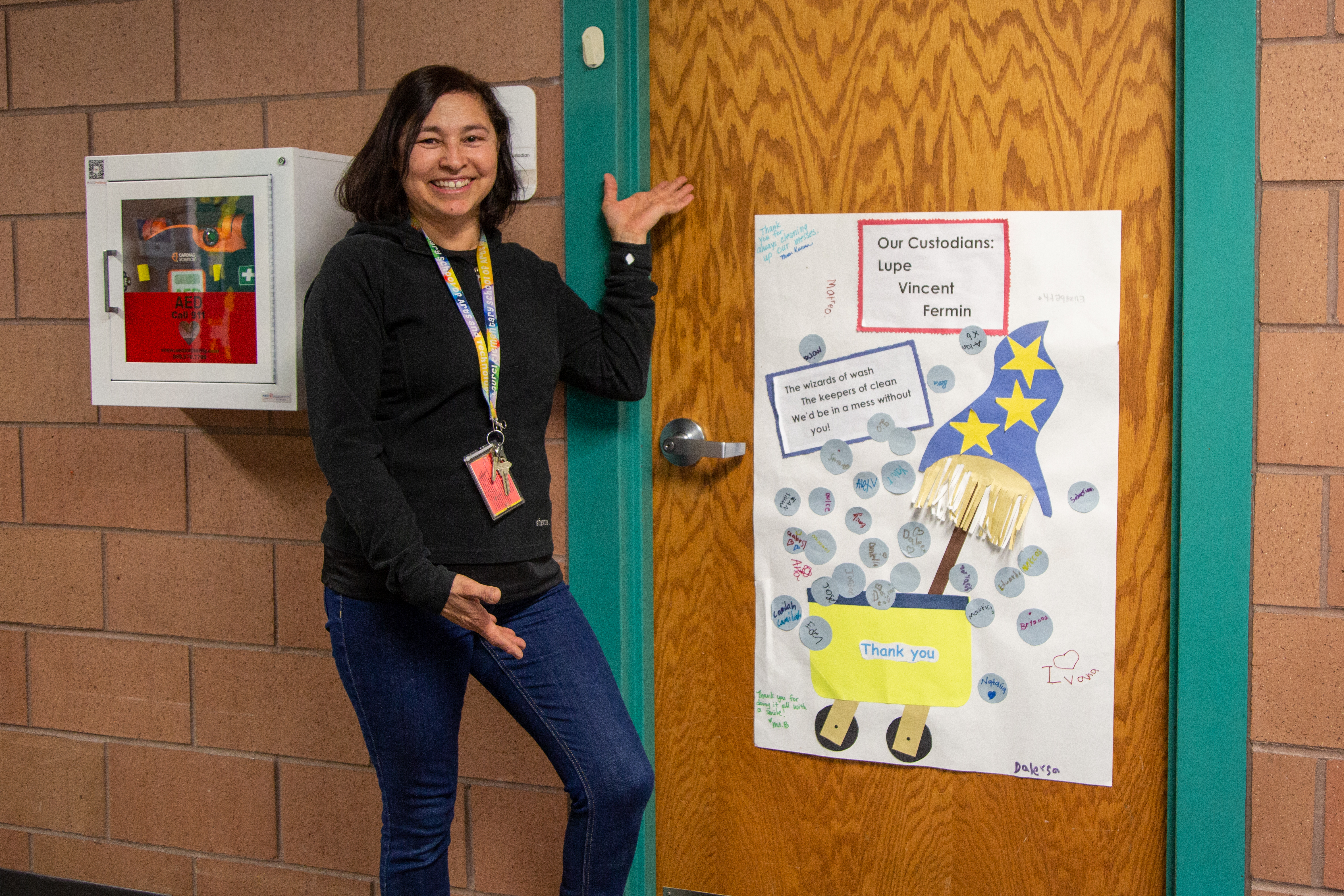 A classified staff person at Laurel Elementary points to her office.
