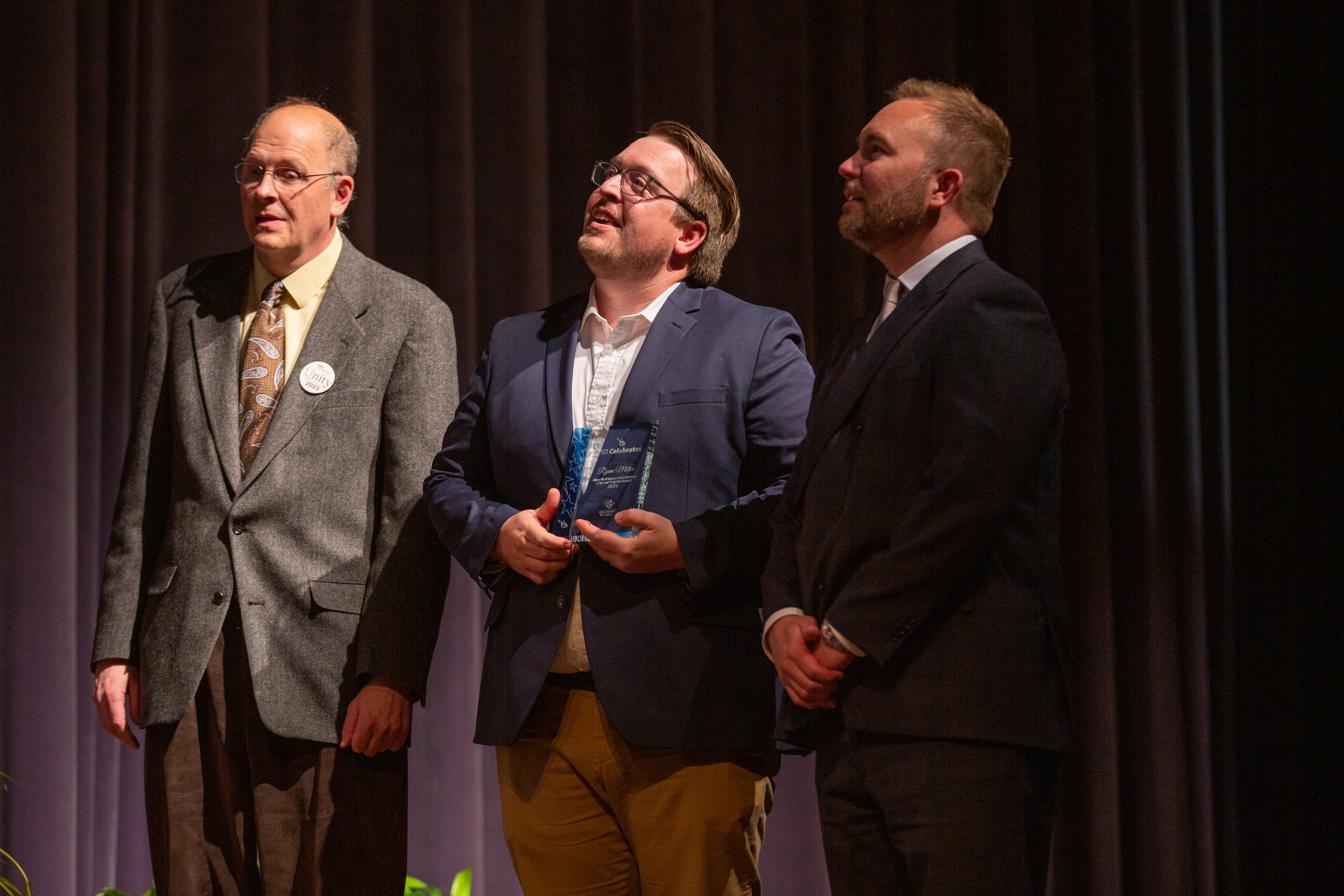 An award winner is recognized at the ceremony.