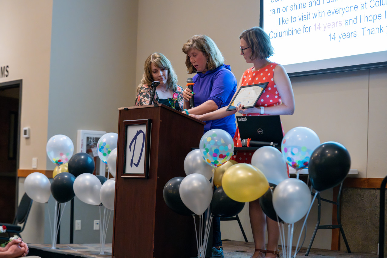 A Project SEARCH graduates speaks at the podium.