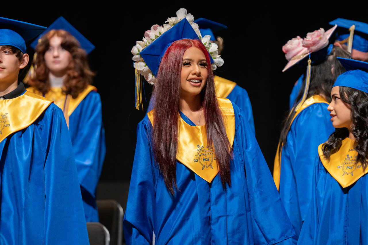 A Poudre Community Academy grad looks out at the audience.