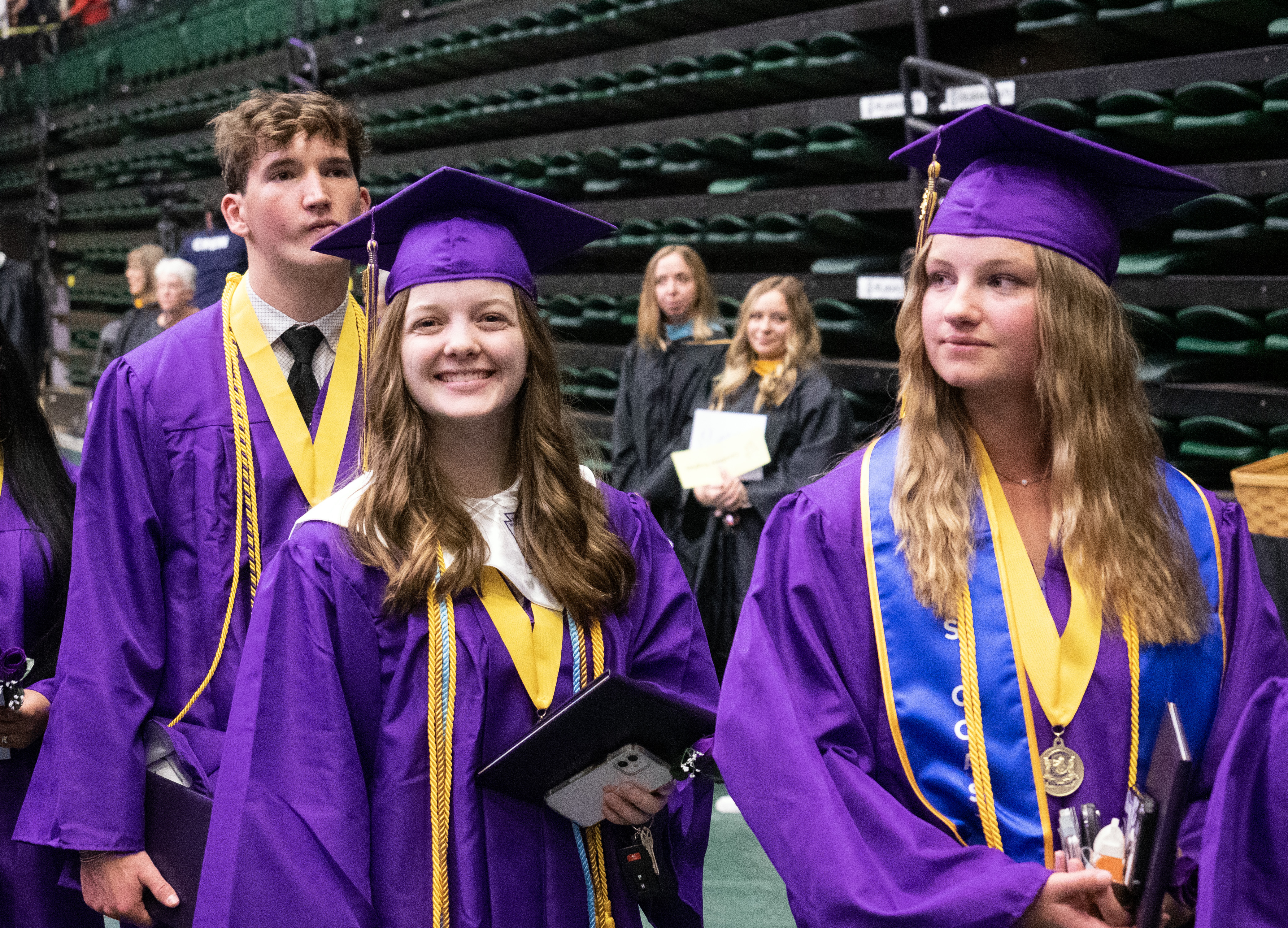 Fort Collins High School graduates walk in. 