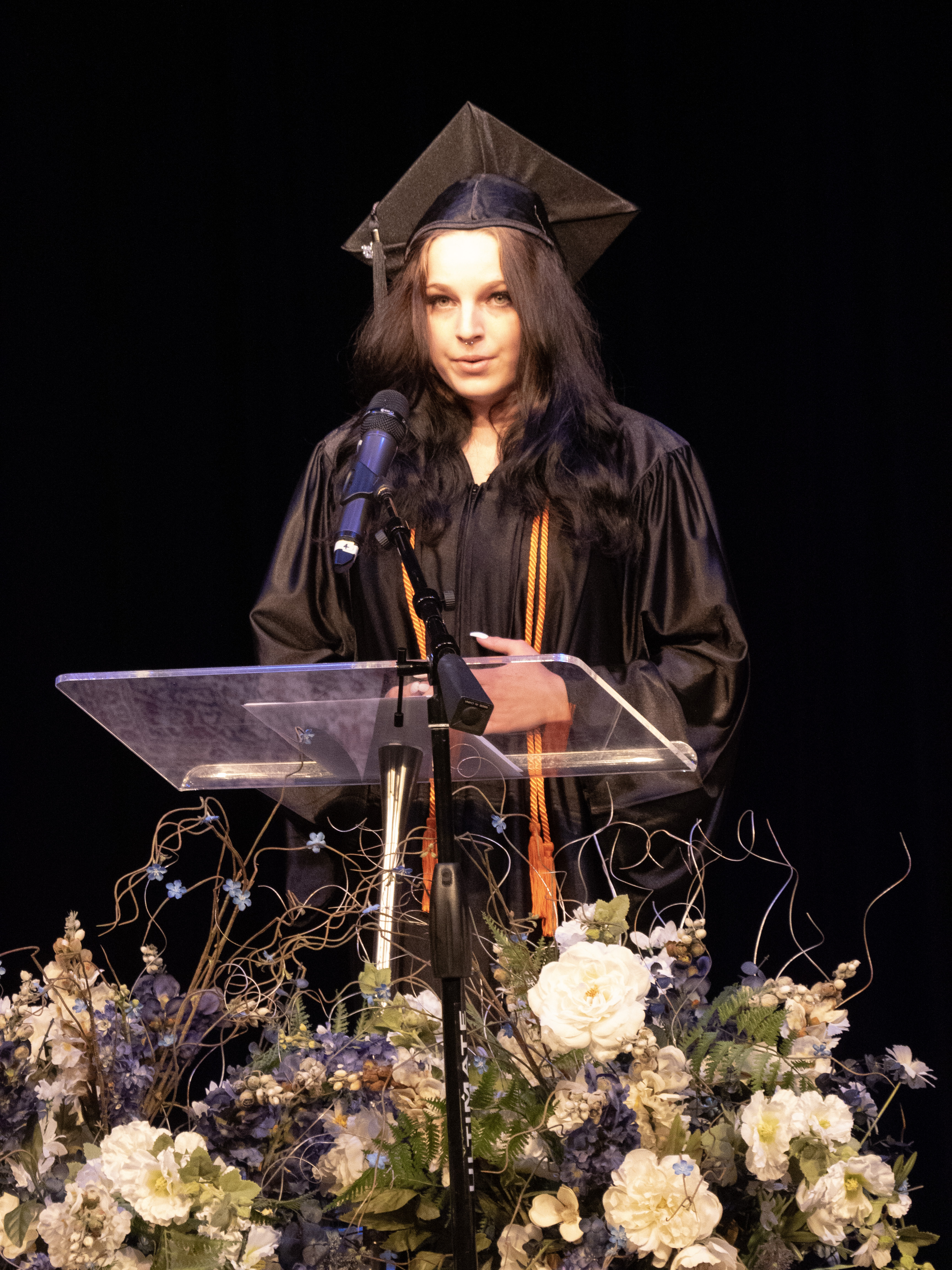 An Opportunities Unlimited program graduate at the podium.