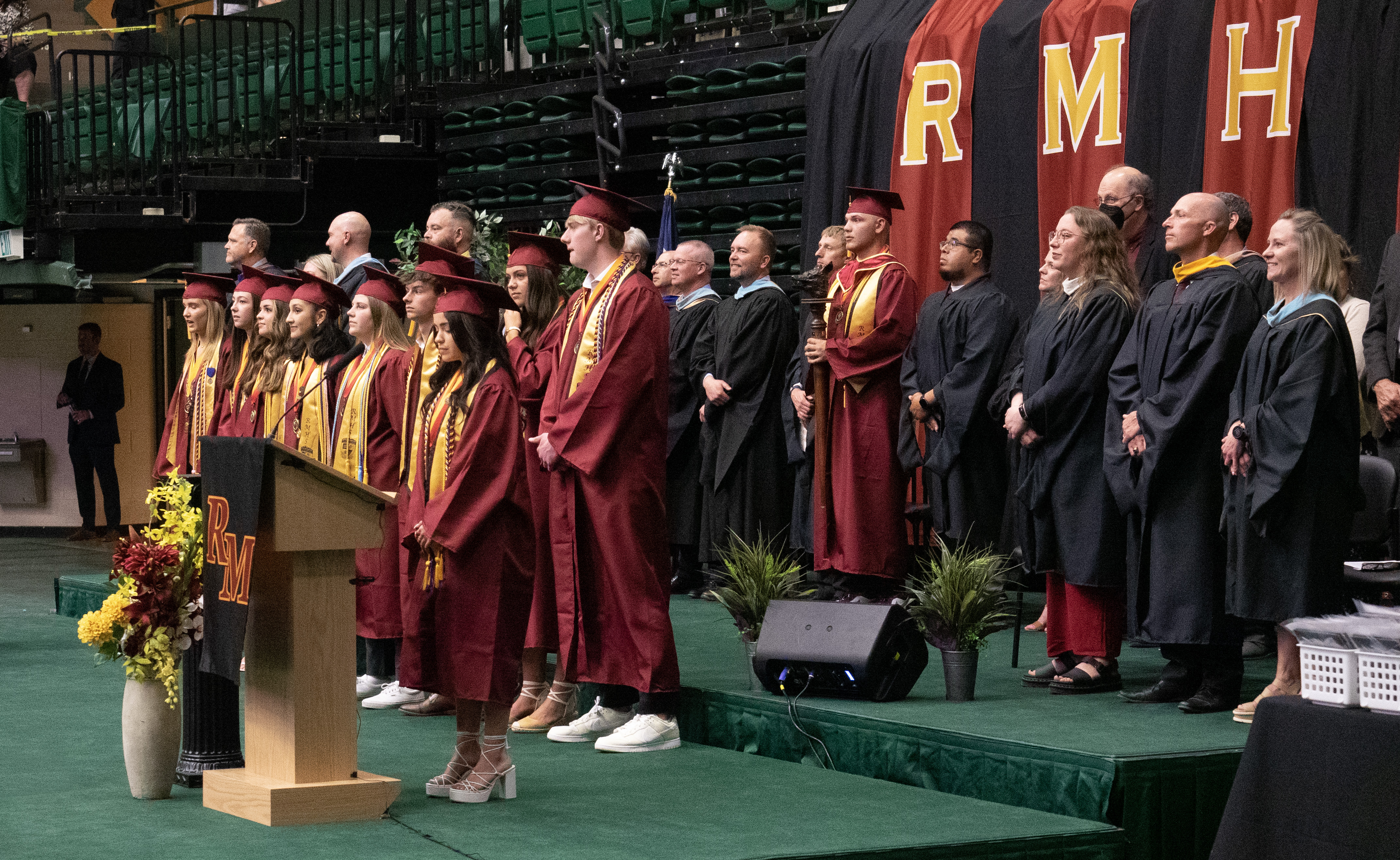 Rocky Mountain High School graduates standing on stage. 