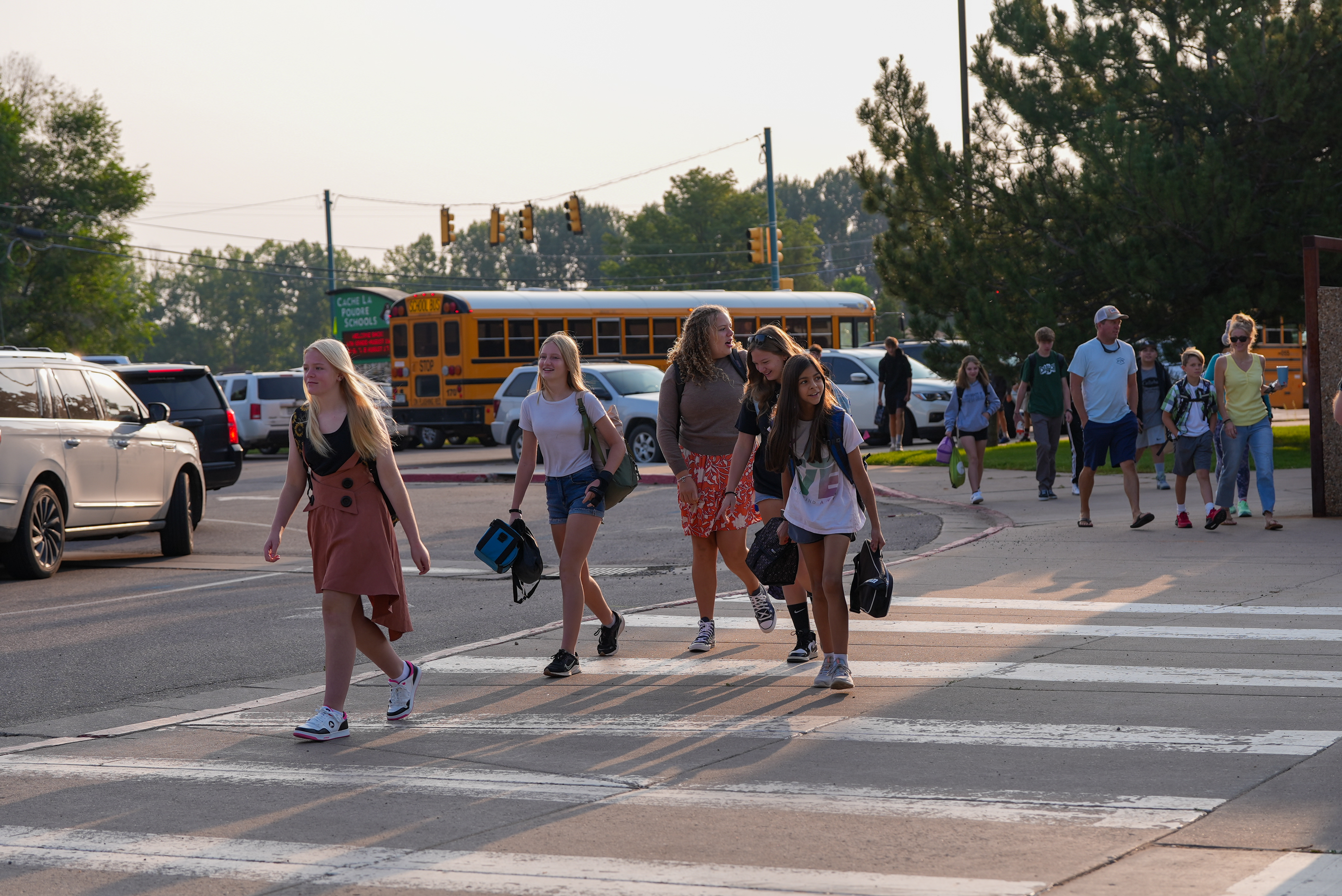 Middle school kids walking to school. 
