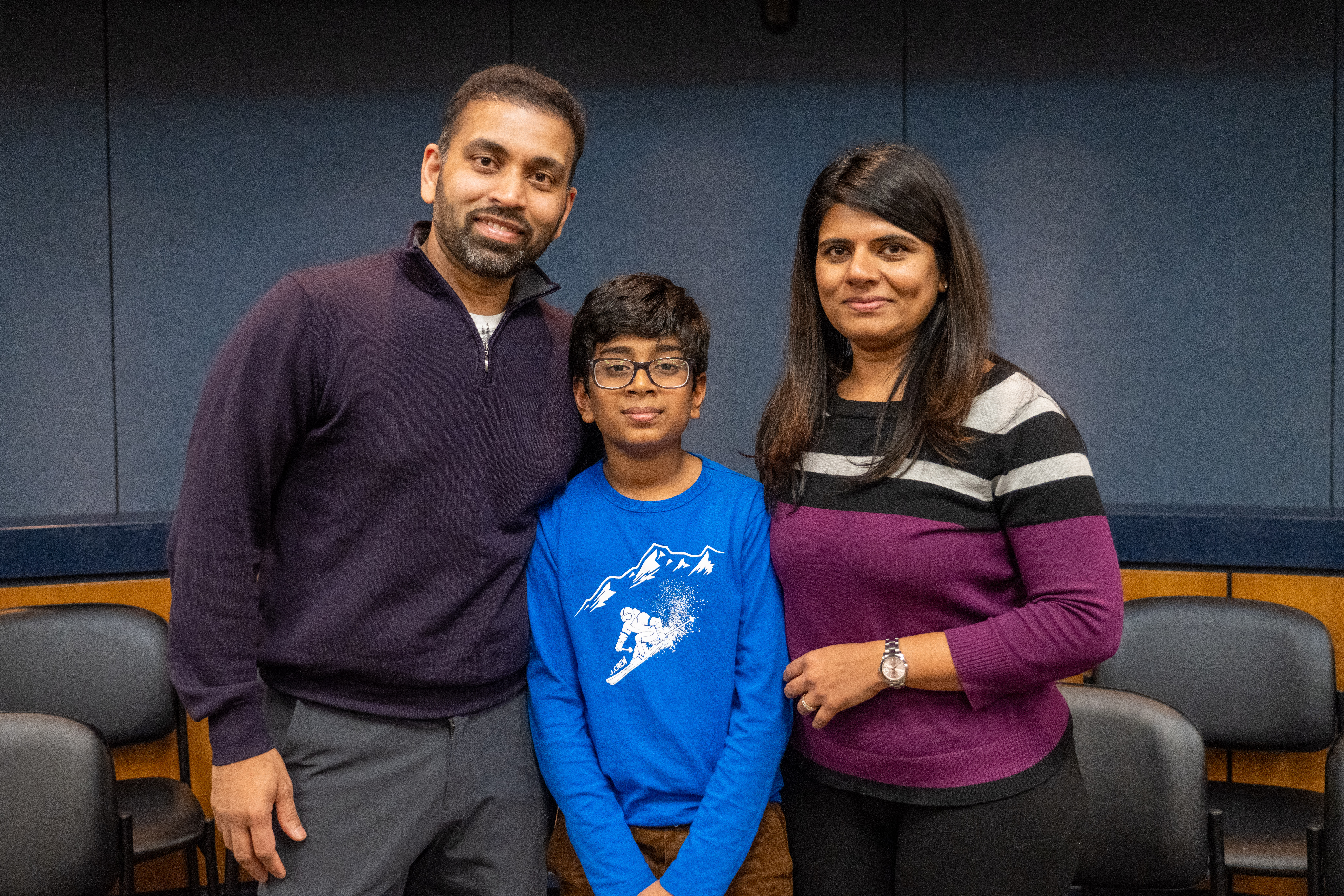 First place winner Nikhil Ganta with his parents.