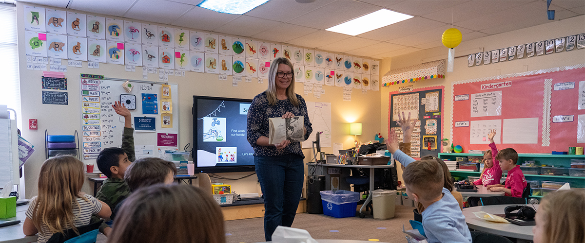 A Livermore Elementary teacher reads to students in class.