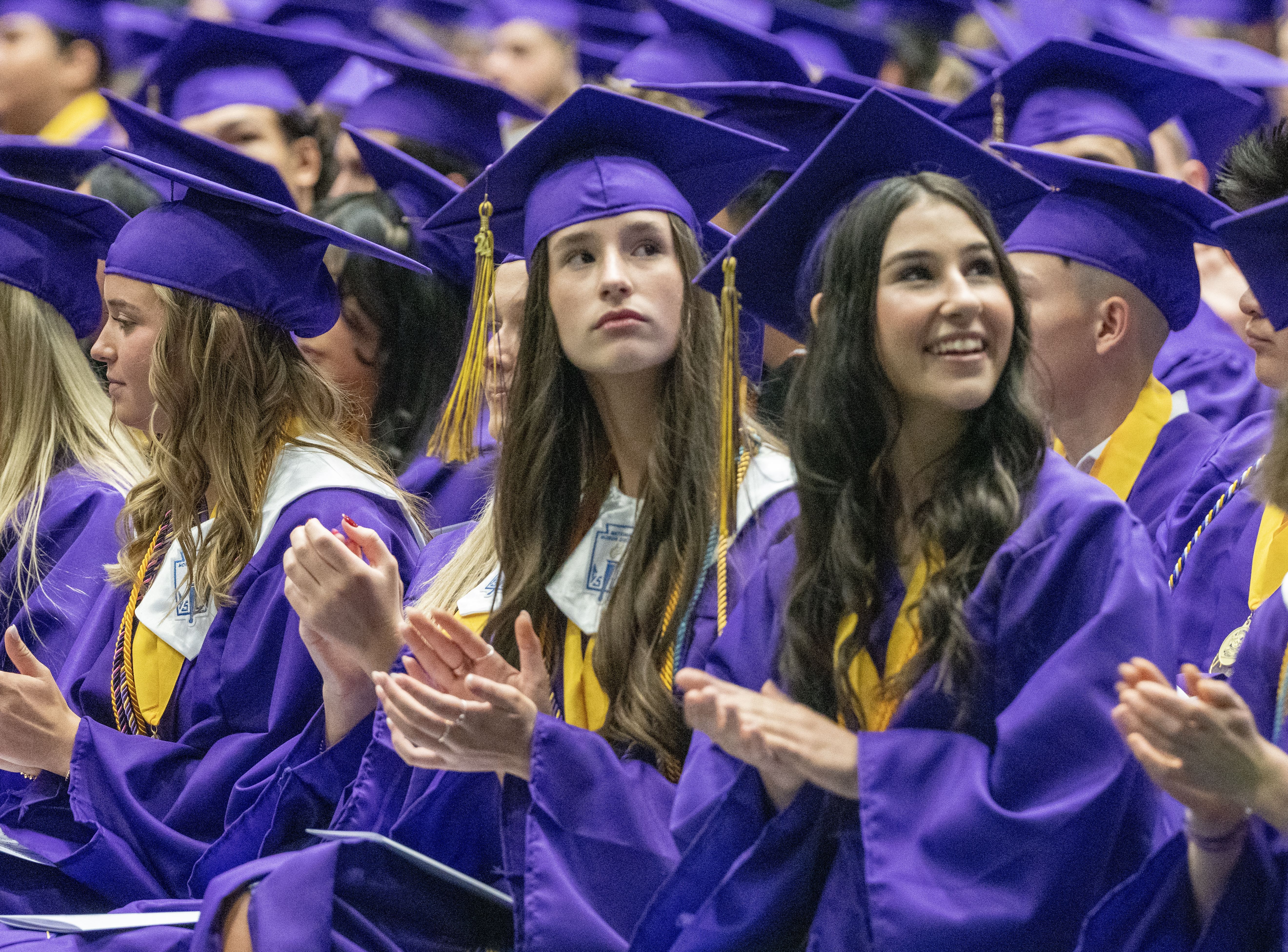 FCHS grads sit together. 