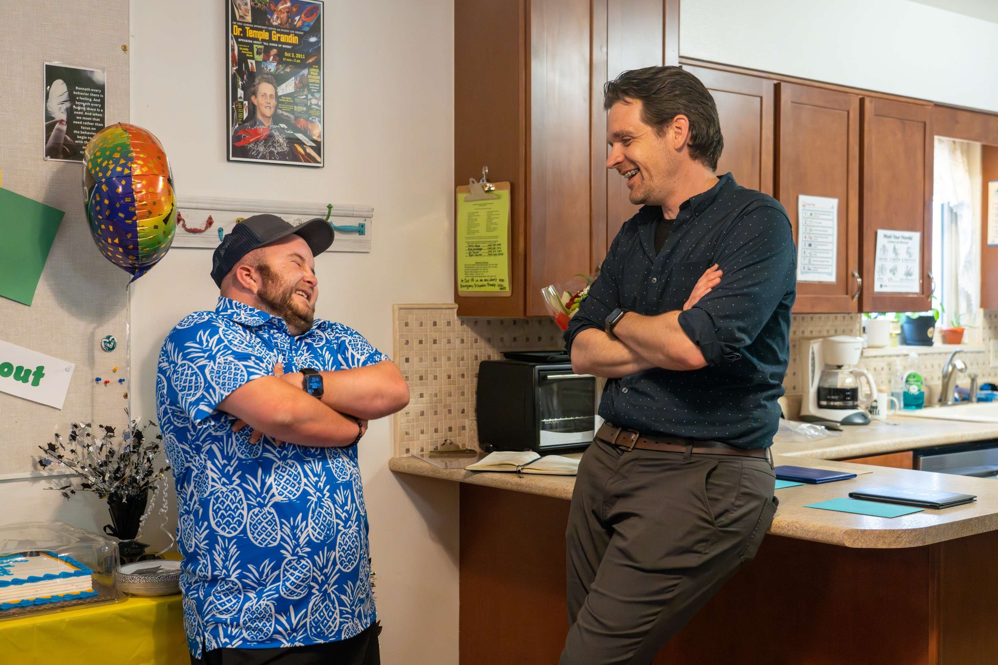 A Cooper Home graduate talks with the director. 