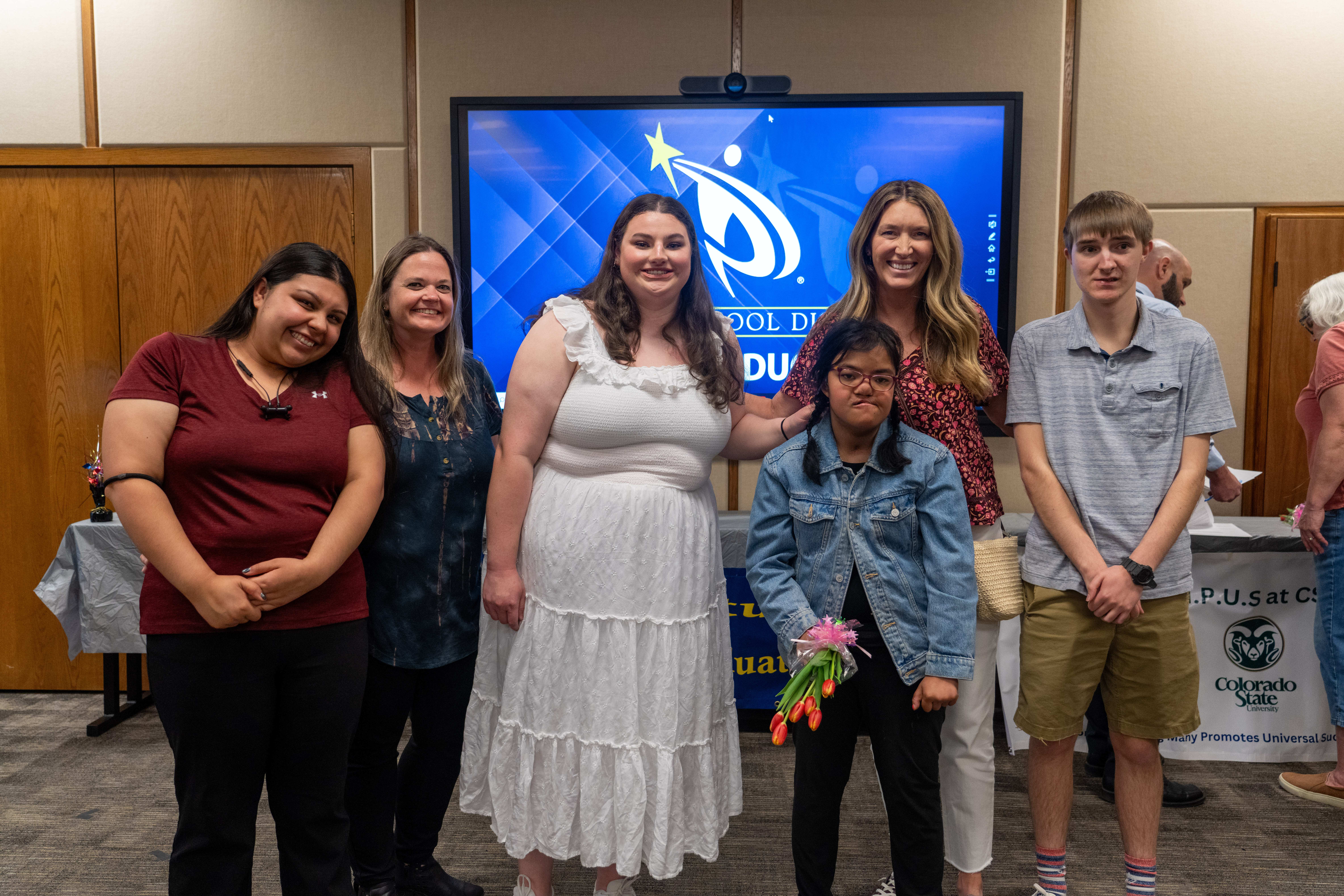 Community Connections graduates pose together.