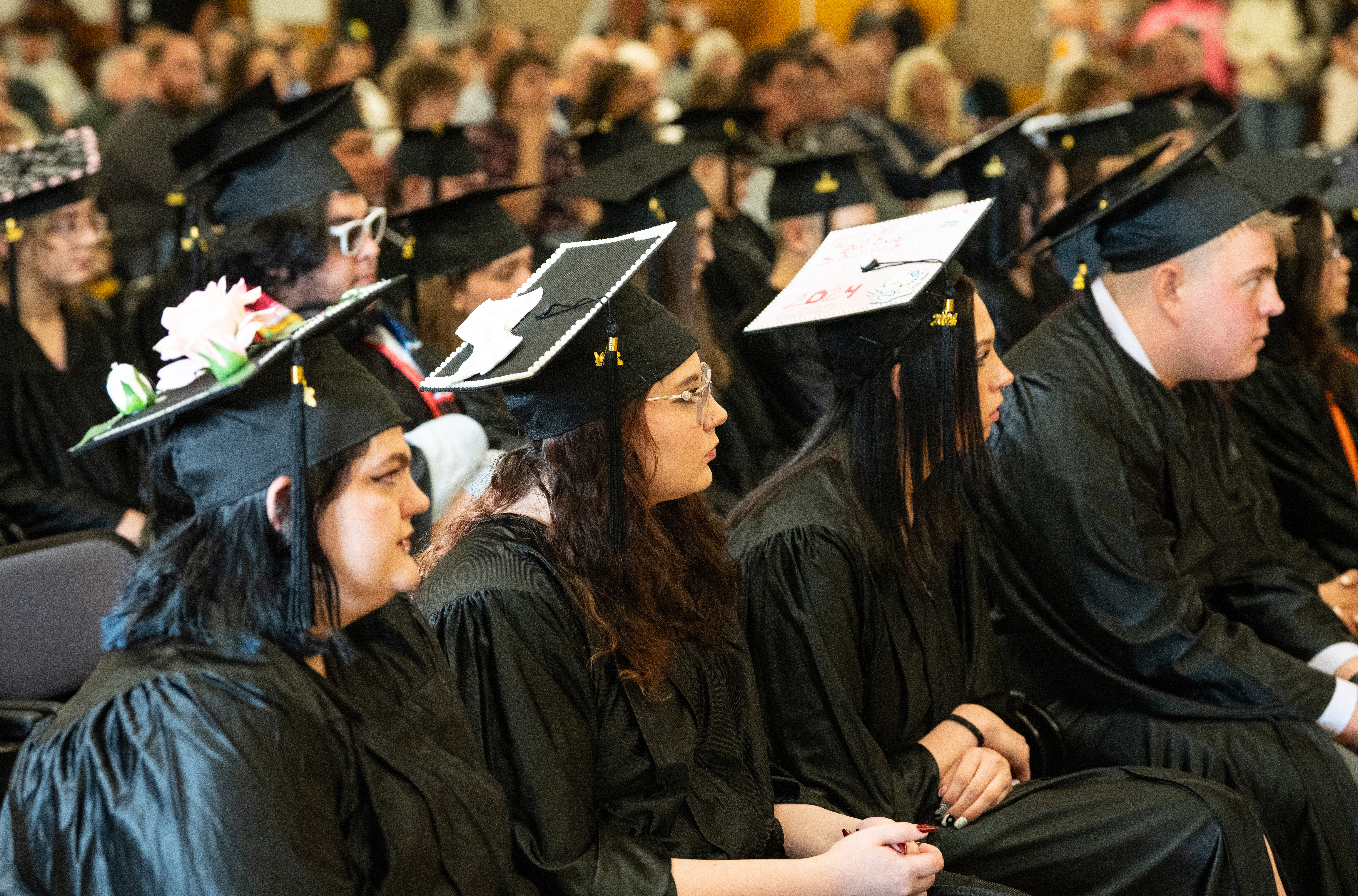 Opportunities Unlimited graduates listen to speakers. 