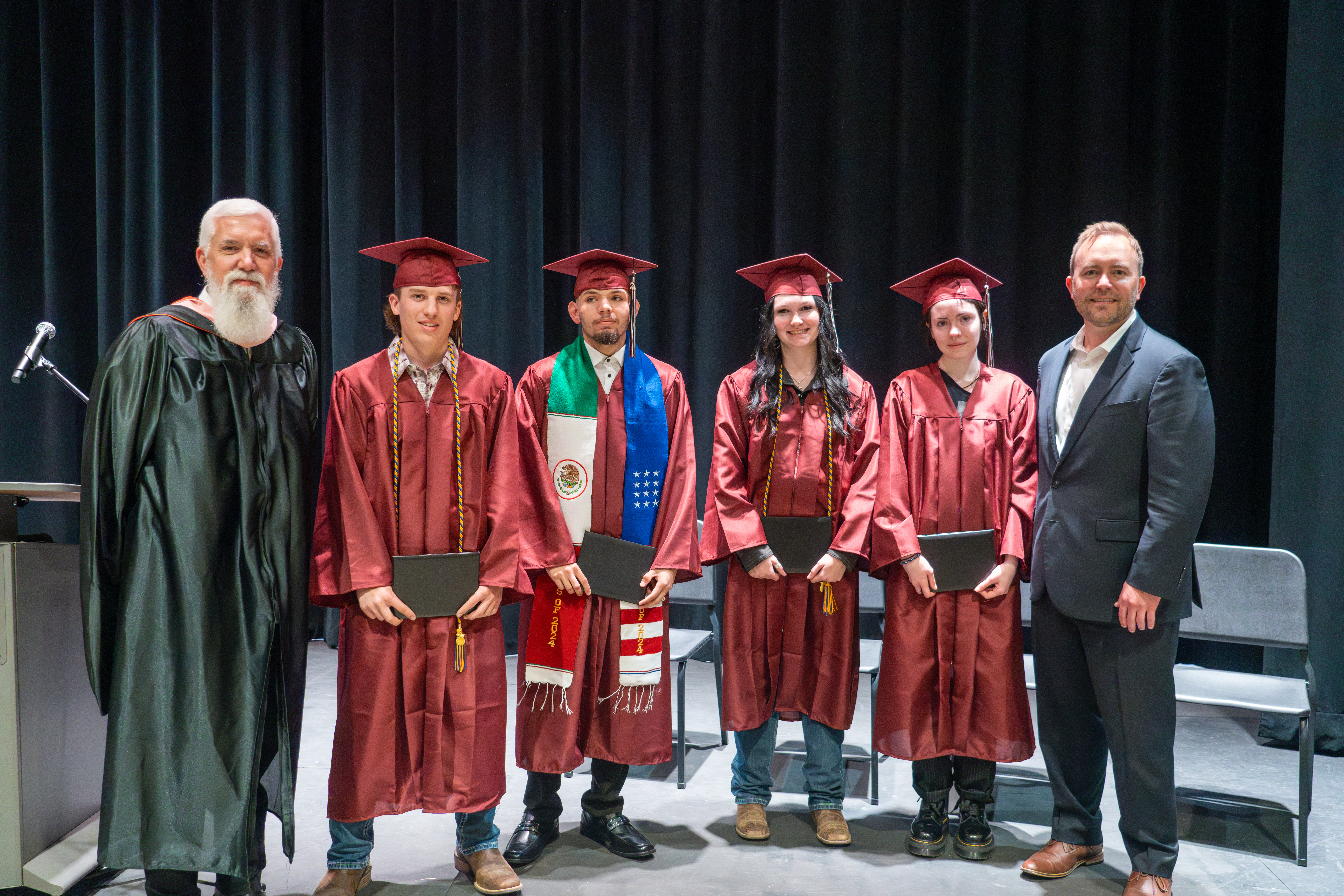 Wellington Middle High School grads pose with the principal.