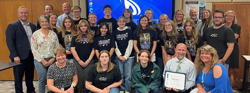 PSD Board of Education members pose with students and staff honored with recognitions. 