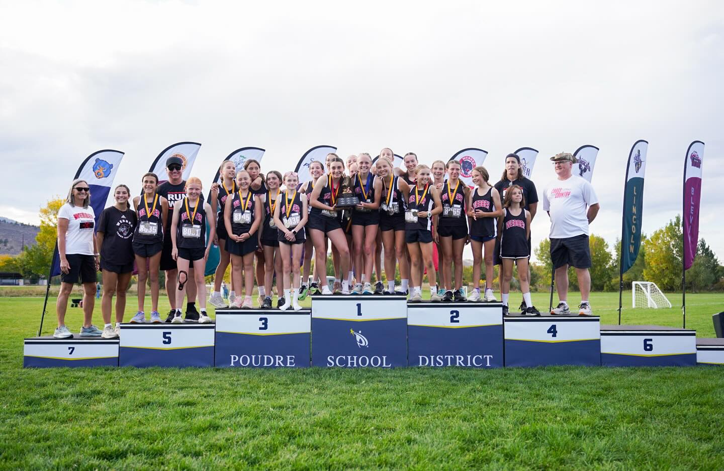 Webber Middle School Cross Country runners on podium