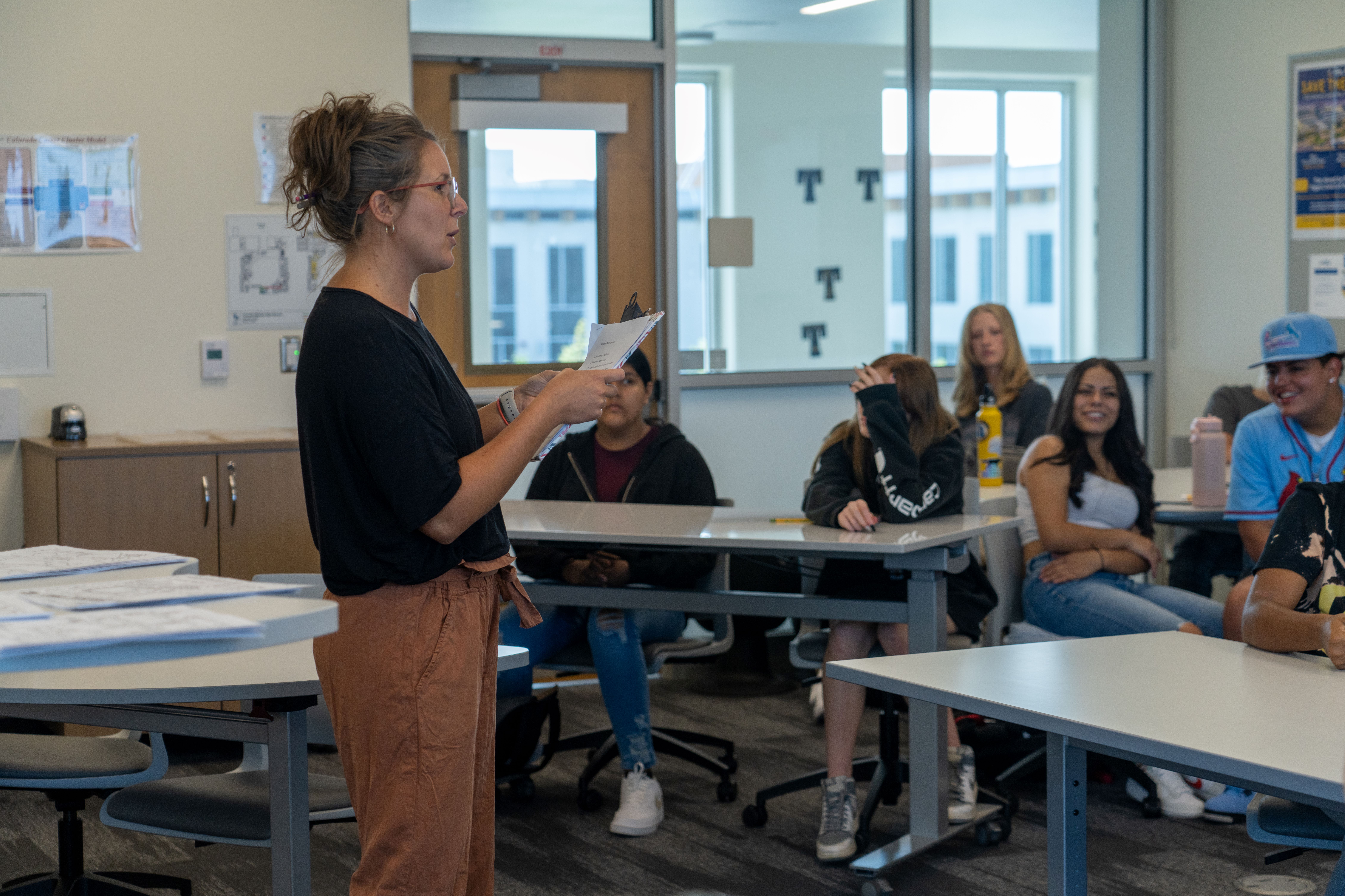 Shannon Wawrzyniak talks to high school students in her classroom.