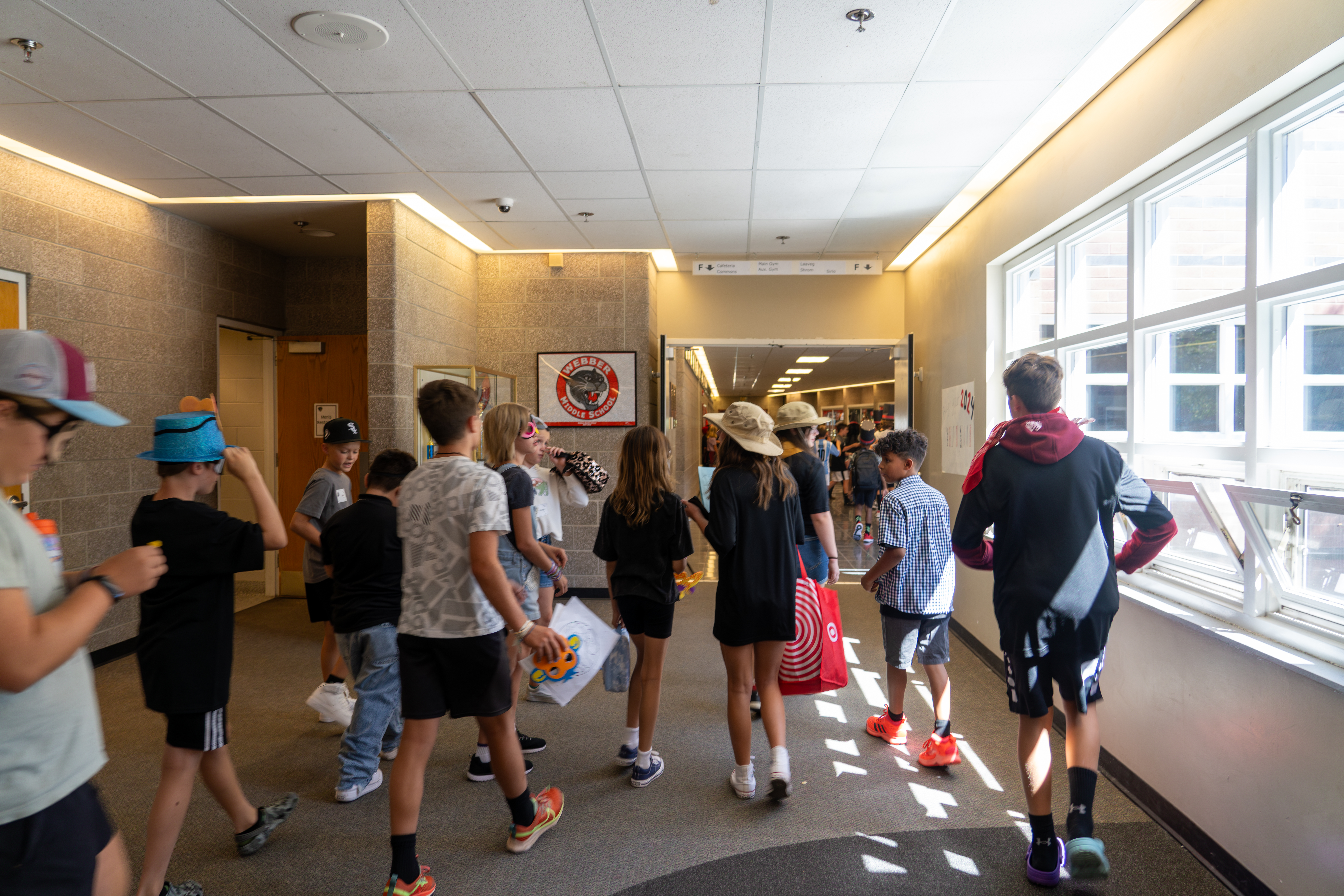 Webber Middle School students walk in the hallway.