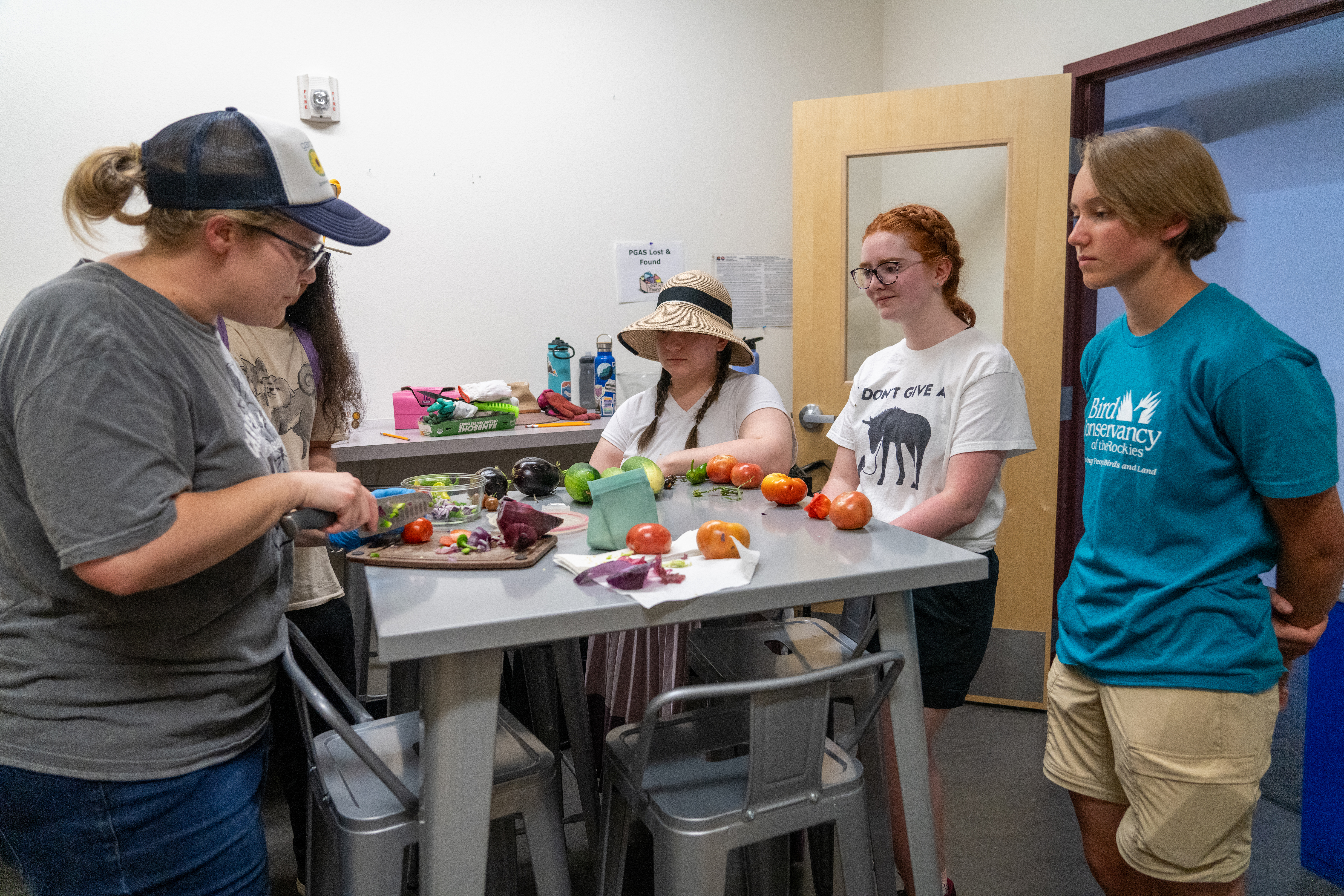 Students cook together with the vegetables that they grew from the garden.