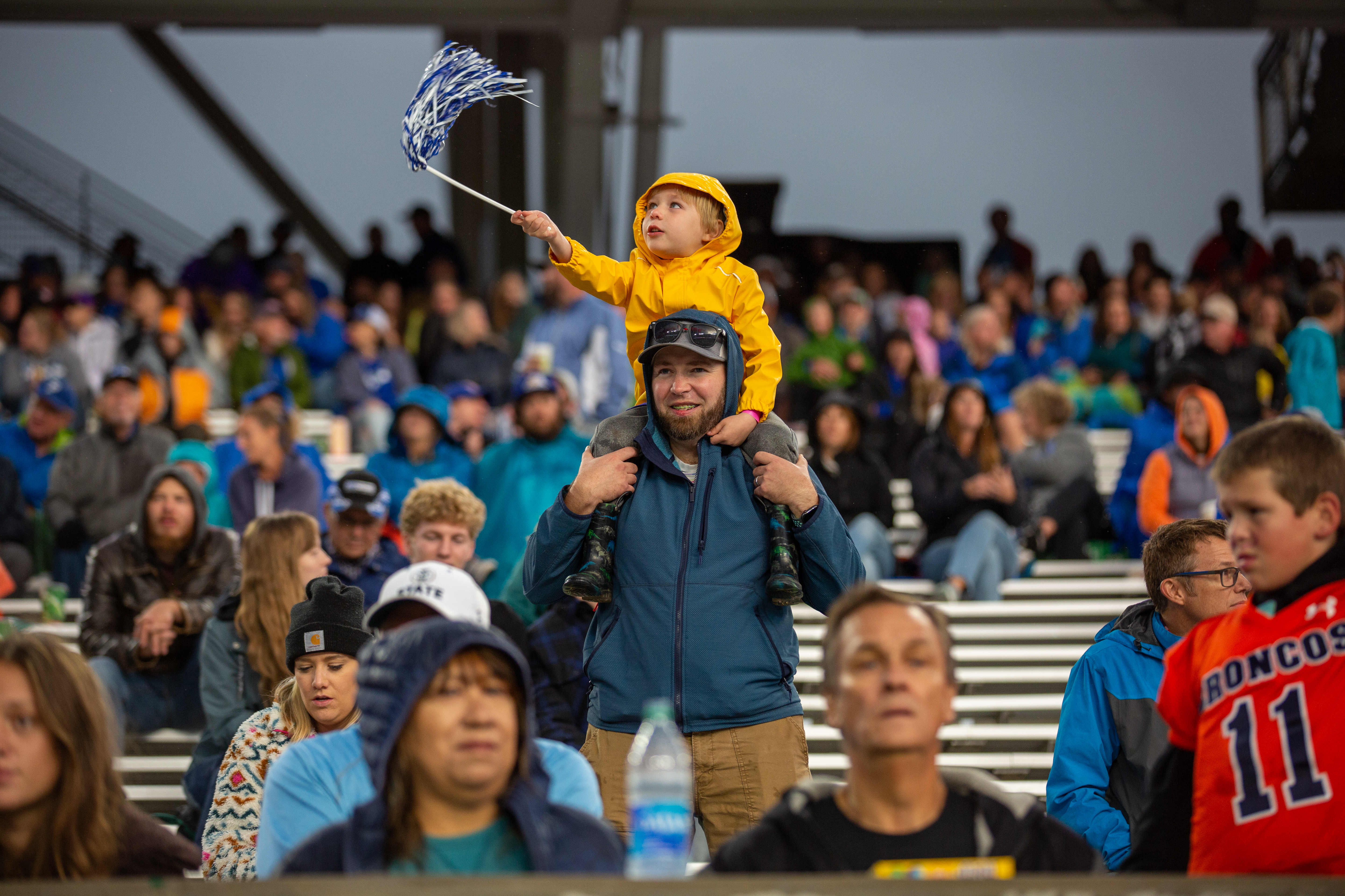 A young fan cheers while on his dad's shoulders at the 2022 Canvas Community Classic.