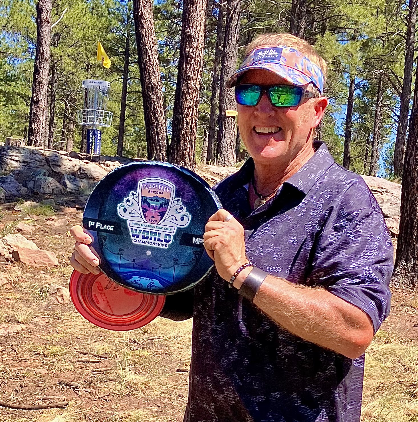 Hank Kirwin holding his championship disc award. 