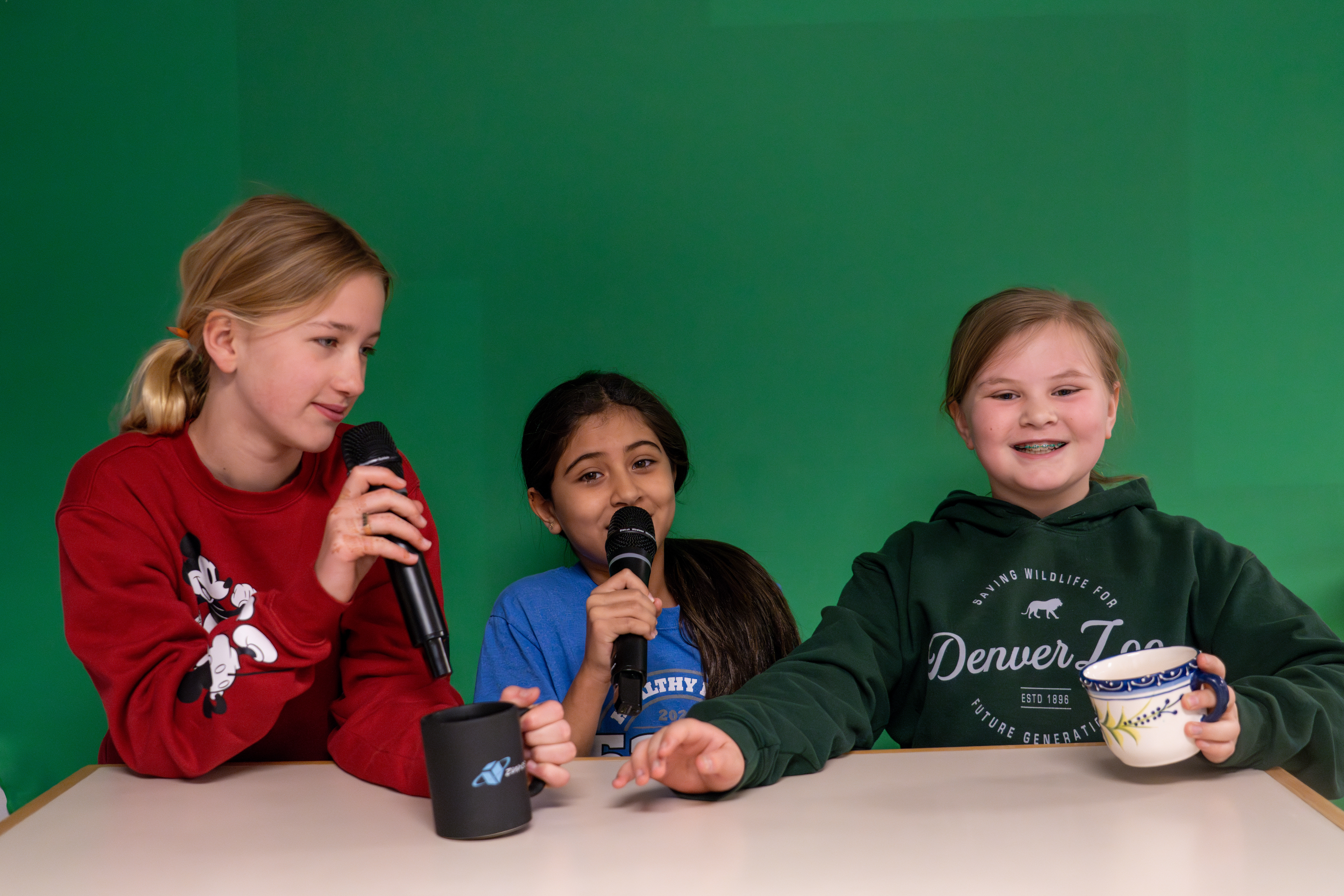 Bauder Elementary girls work on their tv production video.