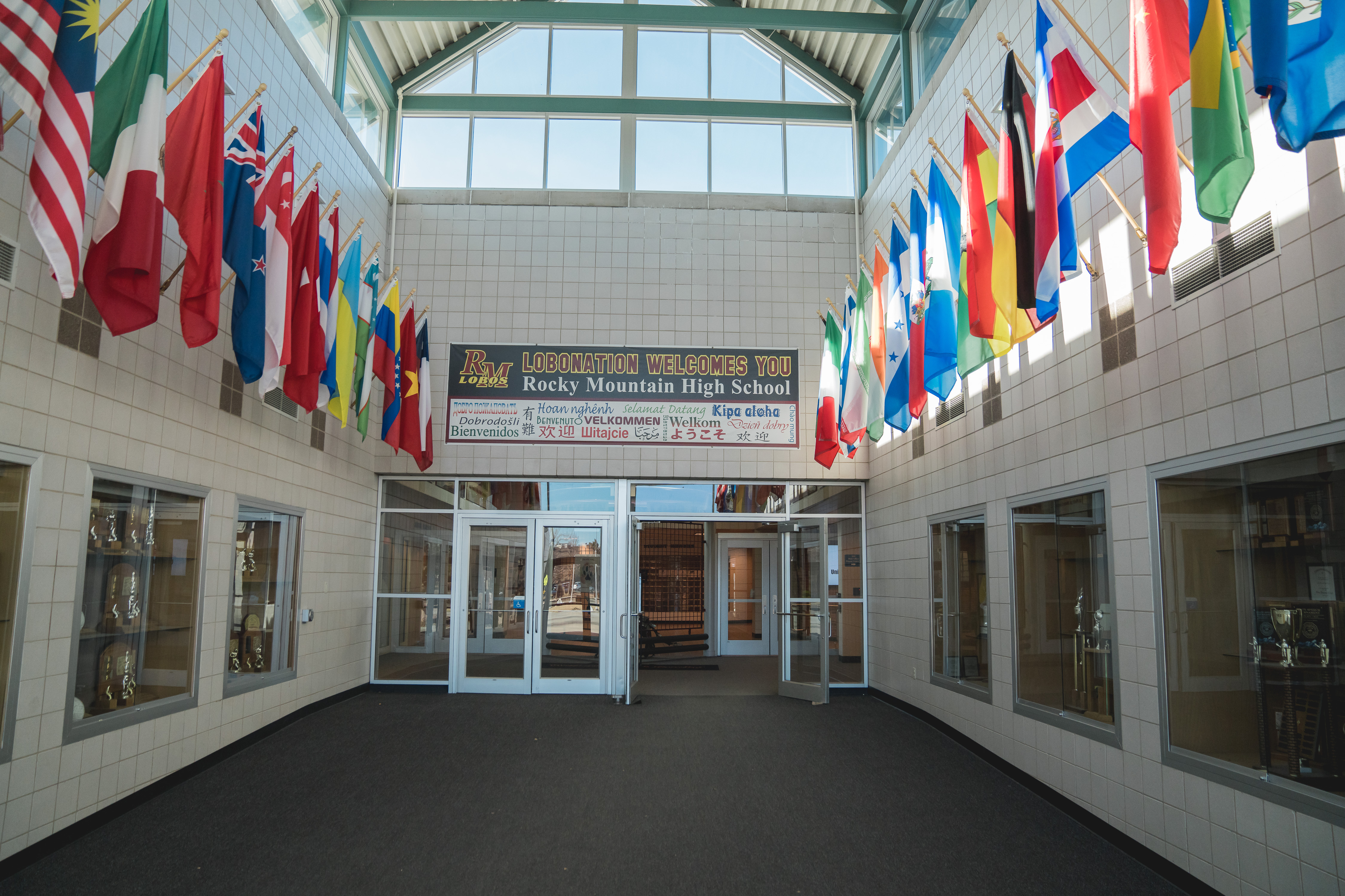 Flags line a hallway in a PSD school. 