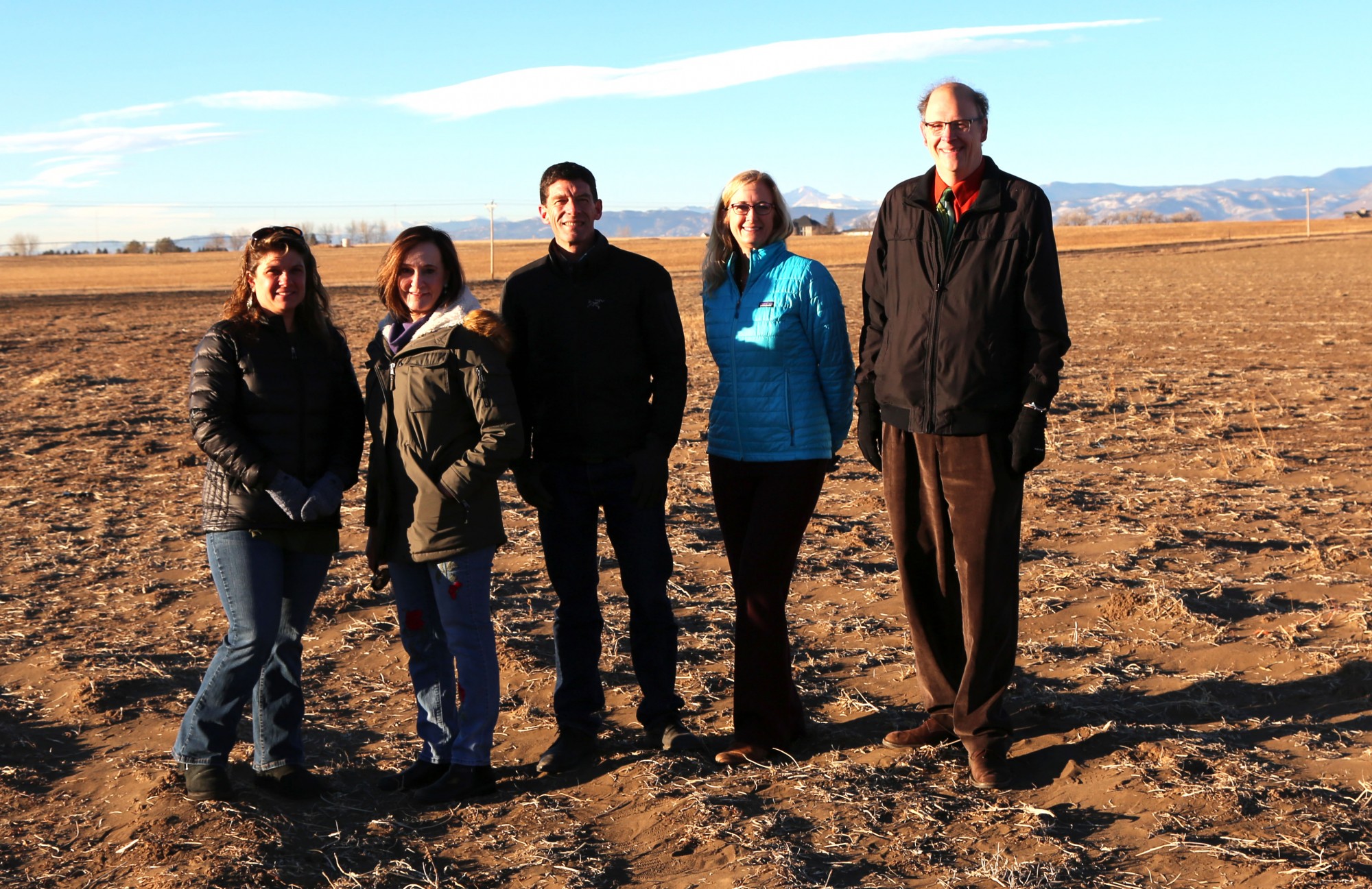 PSD Board of Education members and Superintendent Sandra Smyser stand on the property for the new Wellington school.