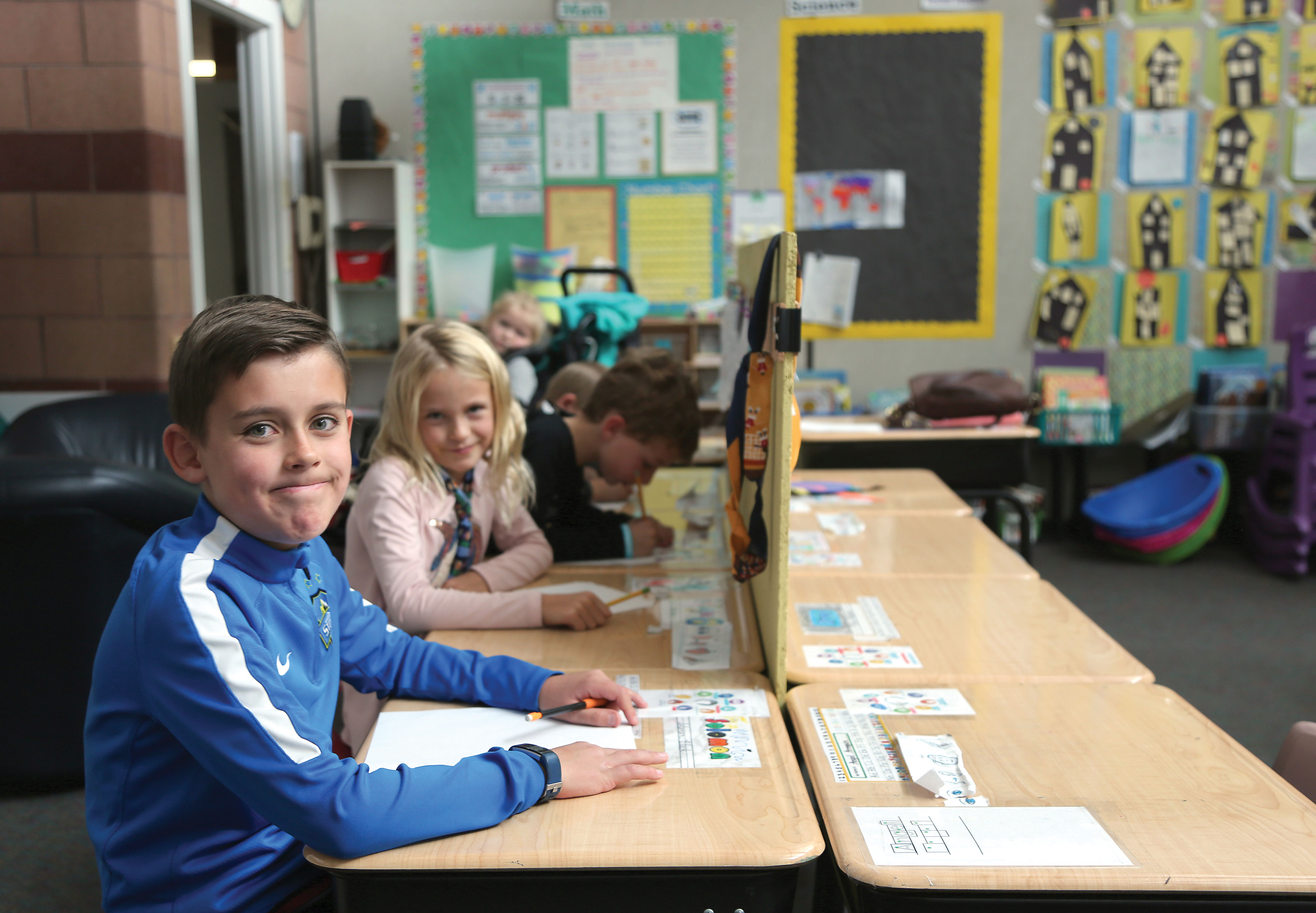 Olander students work on their plans for their invention.