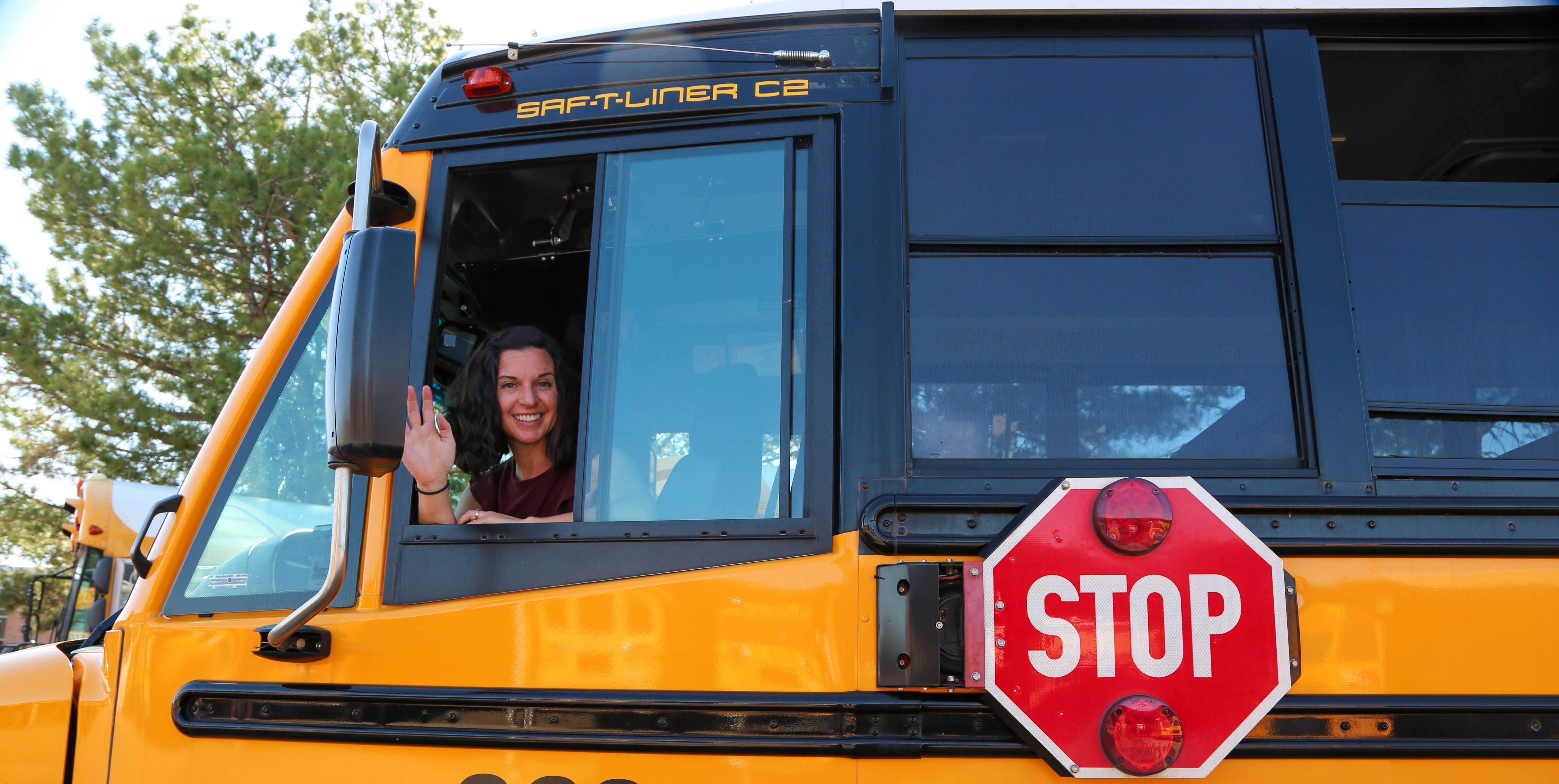 PSD bus driver Jessica Bard waves from the driver's window of the school bus. 