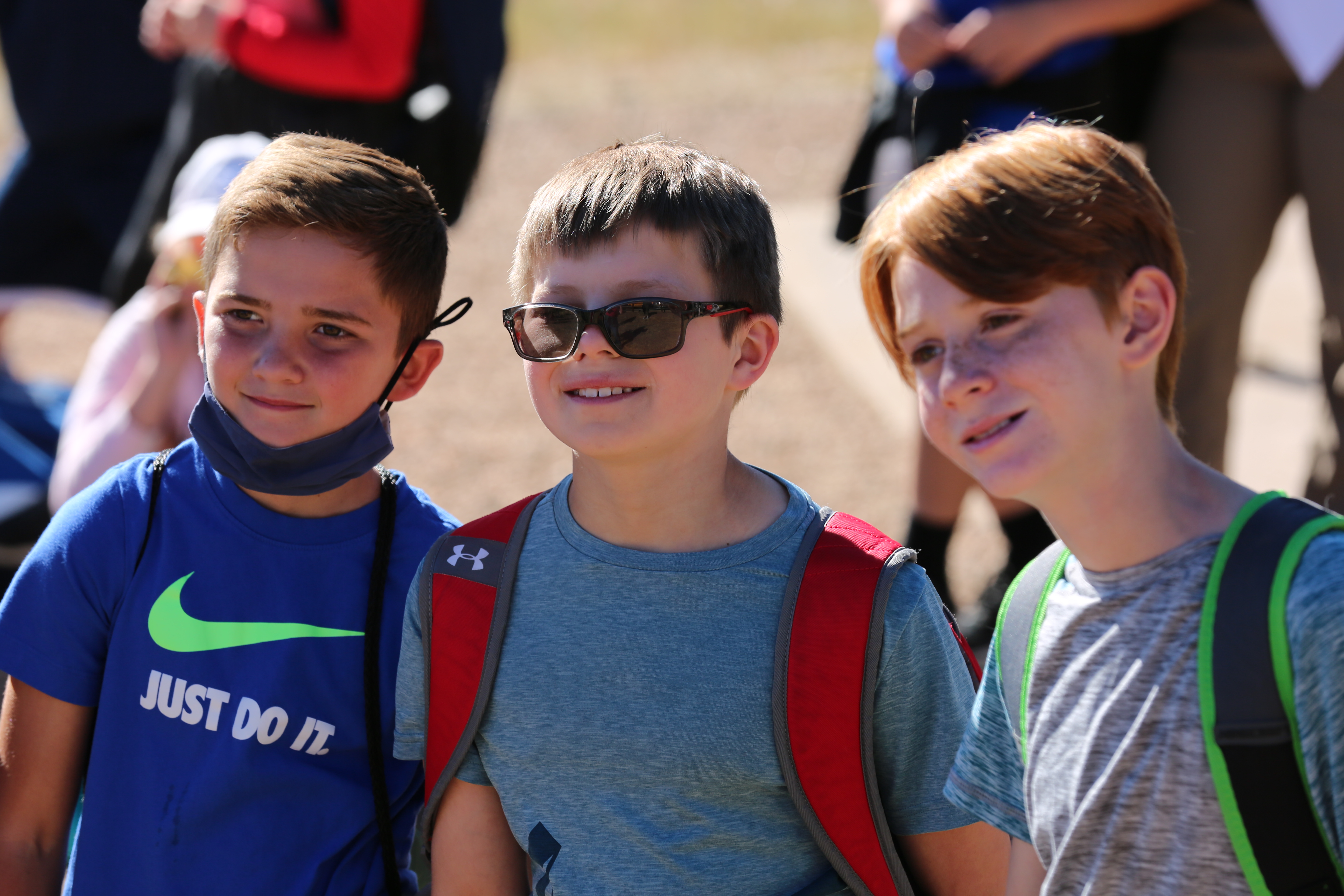 Three Johnson Elementary students hiking together.