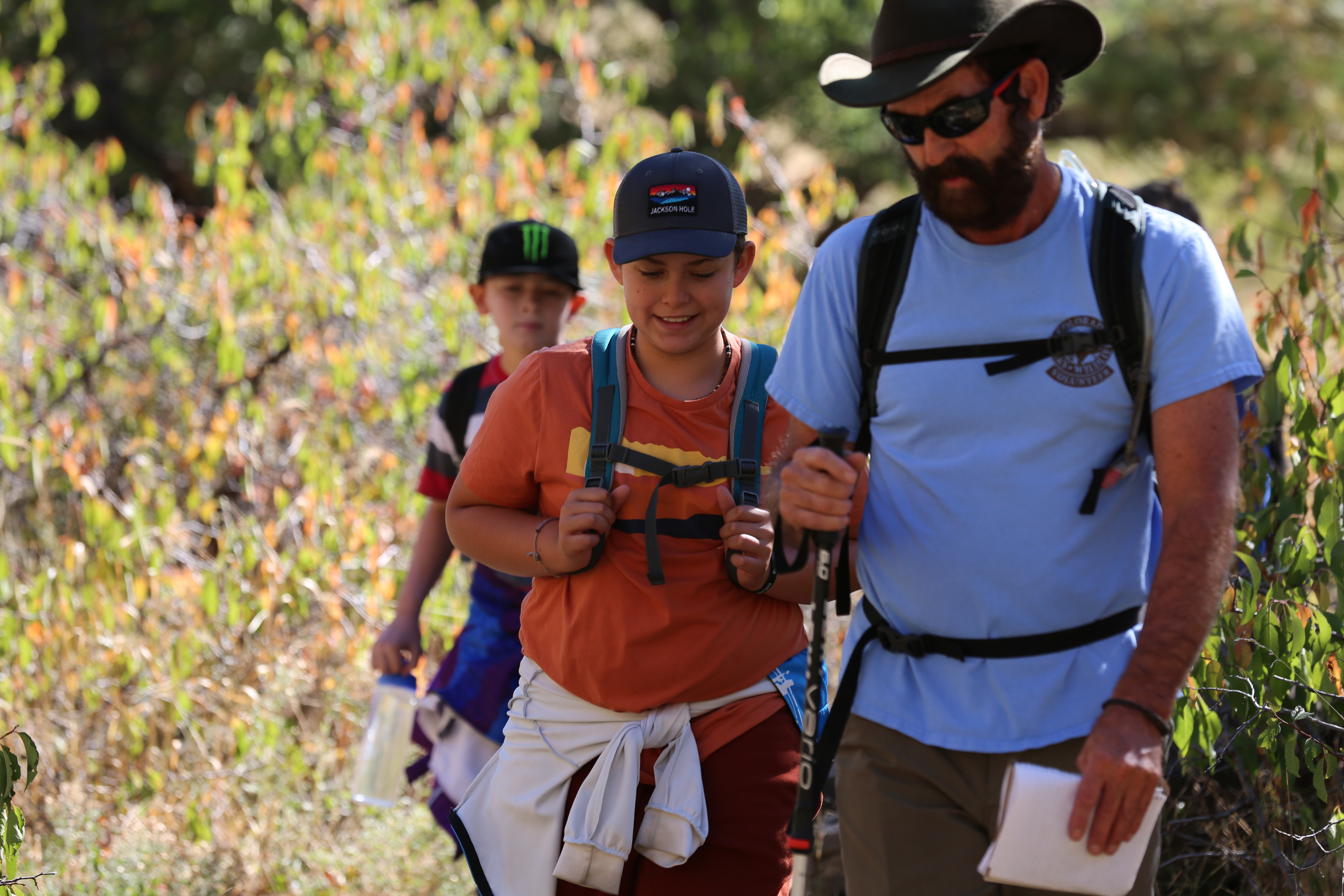A teacher and a student hike together. 