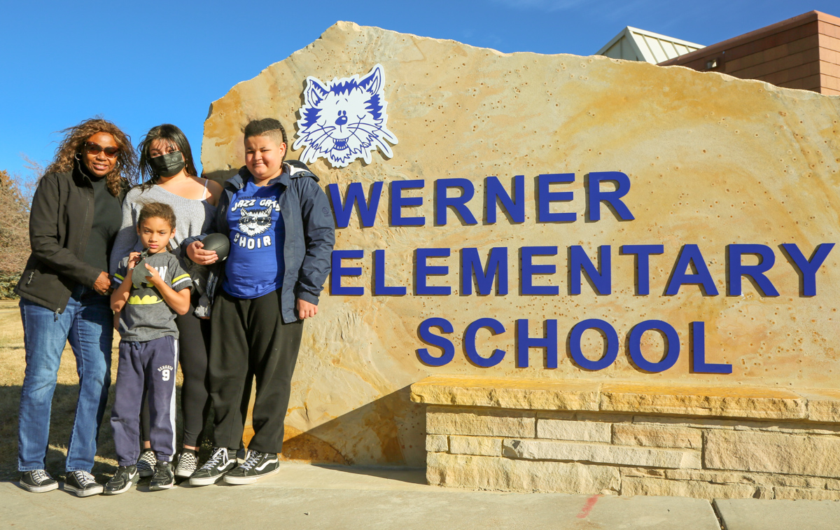 The Embry family in front of Werner Elementary School.