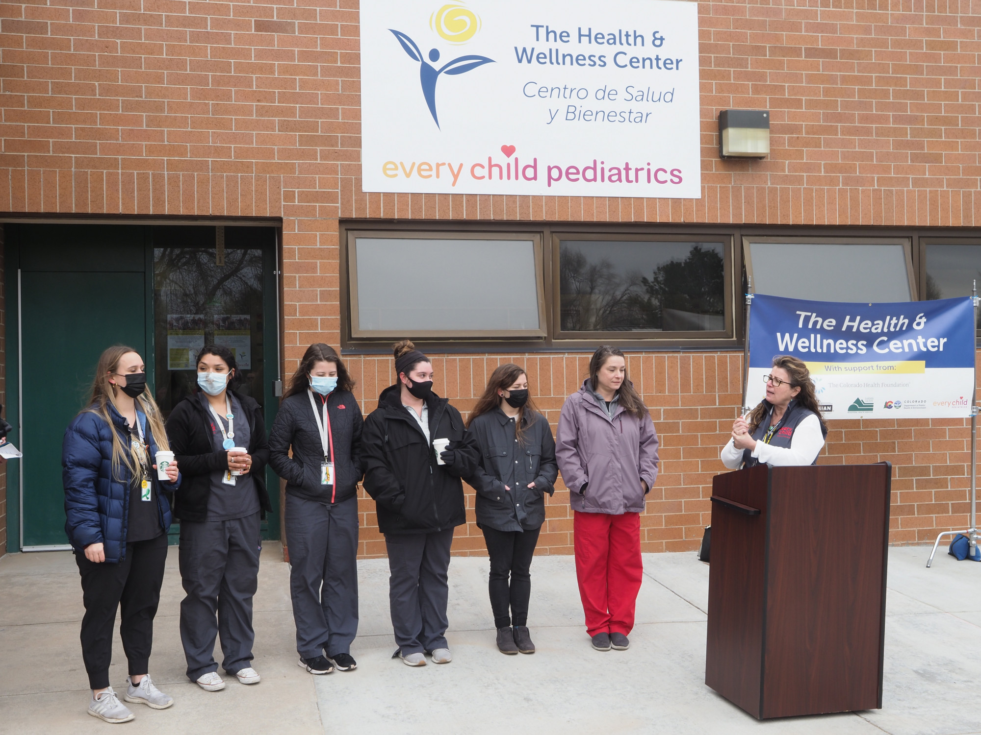 Lincoln Health Center staff stand outside during the opening ceremony for the center.