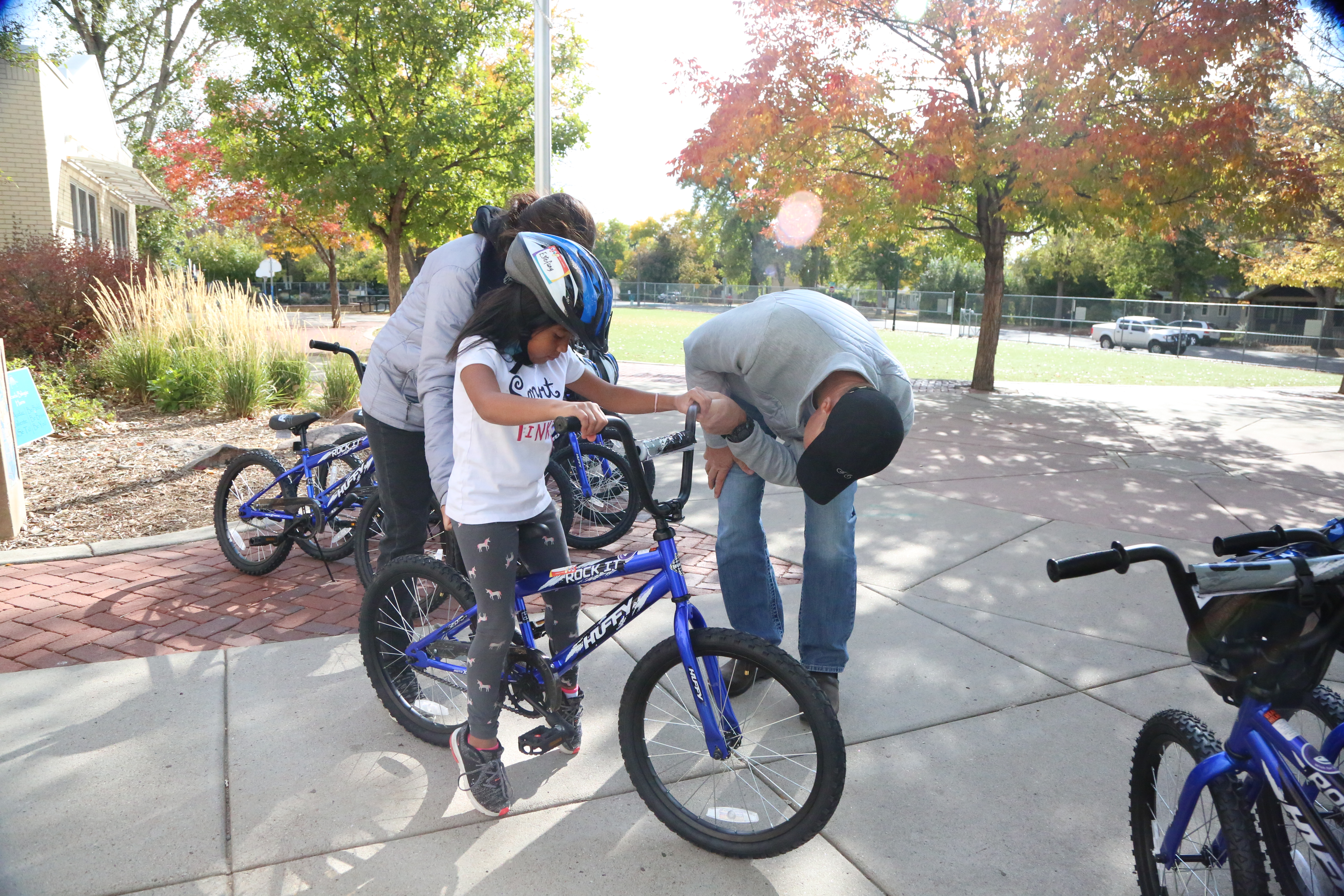 A Harris Elementary students is fitted for her bike that was donated by Wish for Wheels FoCo.