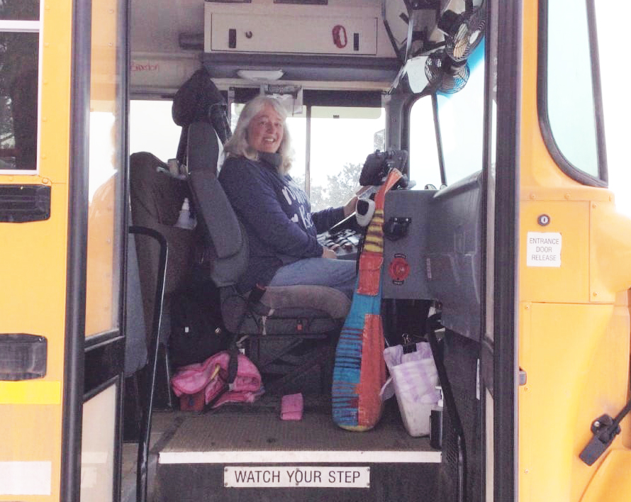 Bus Driver Karen Simpson at the wheel of the bus.