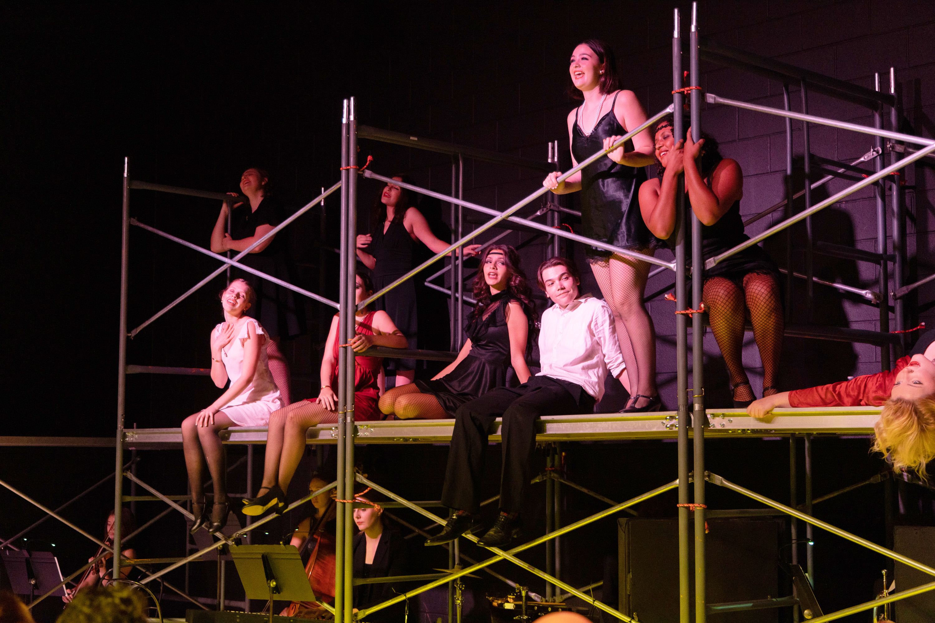 FCHS performers in jazz age costumes perform on stage in the musical Chicago. 