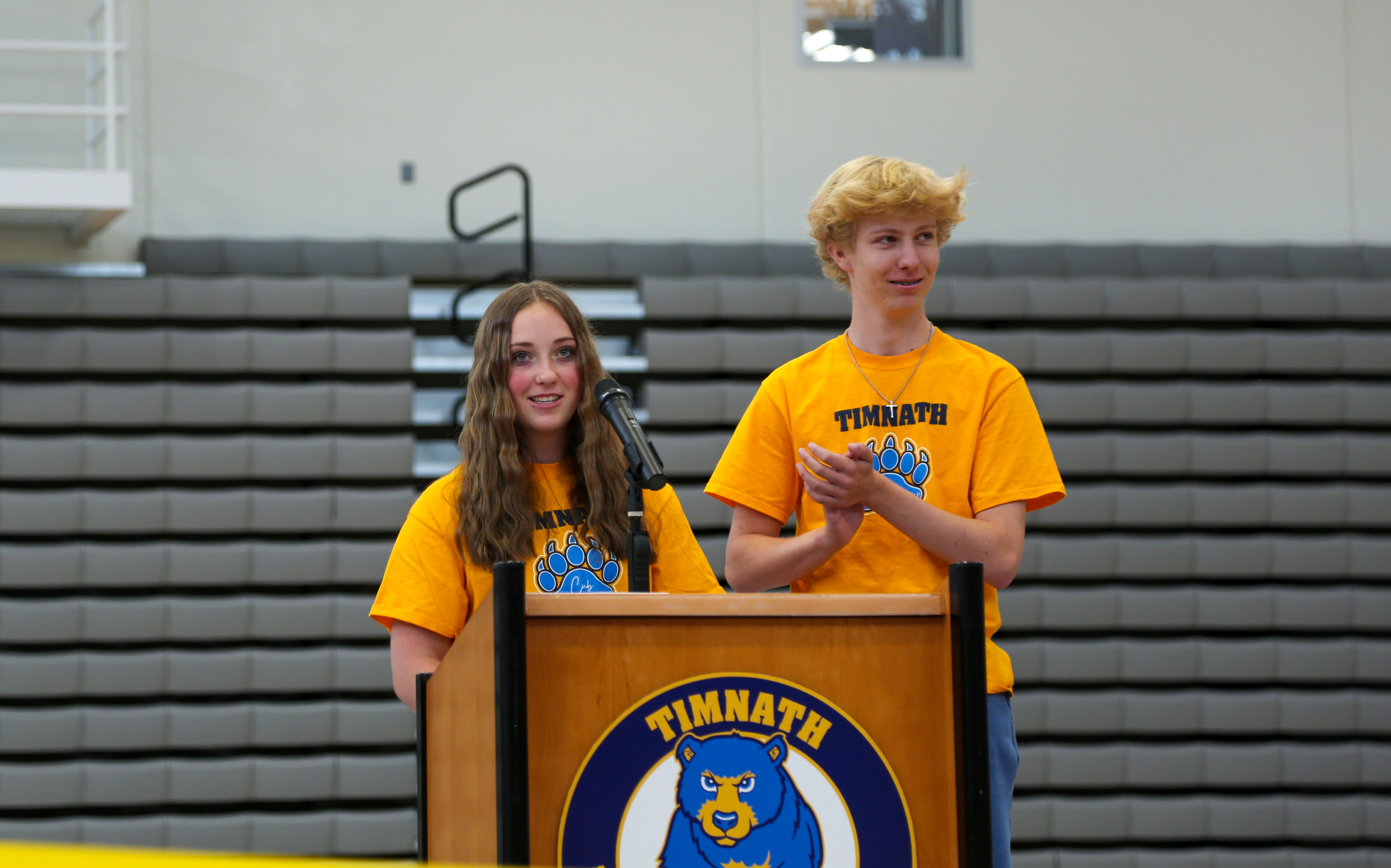 TMHS student leaders Mia Robinson and Julian Miraville speak at the school's grand opening event.